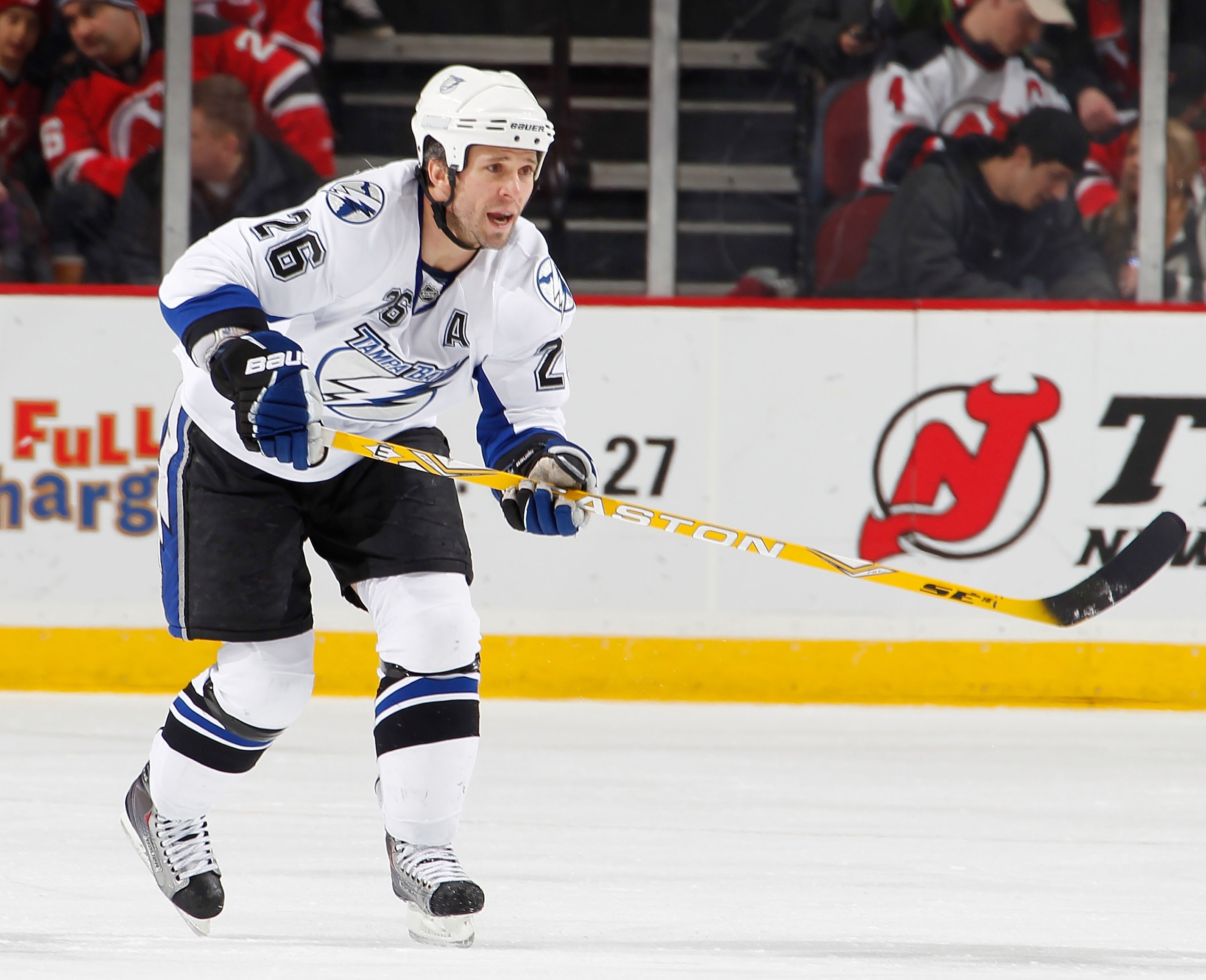 NEWARK, NJ - JANUARY 09:  Martin St. Louis #26 of the Tampa Bay Lightning skates during an NHL hockey game against the New Jersey Devils at the Prudential Center on January 9, 2011 in Newark, New Jersey.  (Photo by Paul Bereswill/Getty Images)