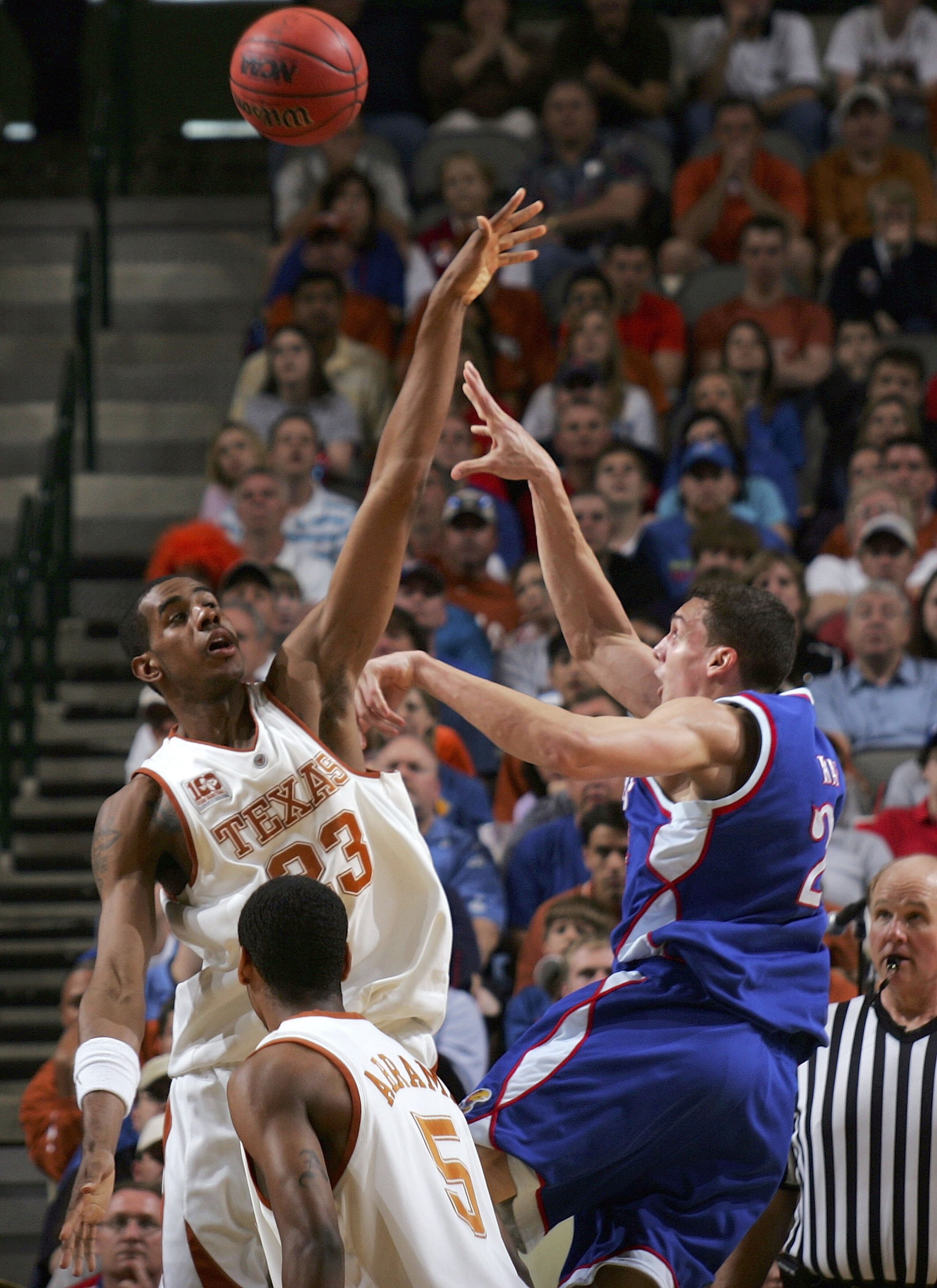 DALLAS - MARCH 12:  Sasha Kaun #24 of the Kansas Jayhawks shoots against LaMarcus Aldridge #23 of the Texas Longhorns during the final of the Phillips 66 Big 12 Men's Basketball Championship Tournament at American Airlines Arena on March 12, 2006 in Dalla