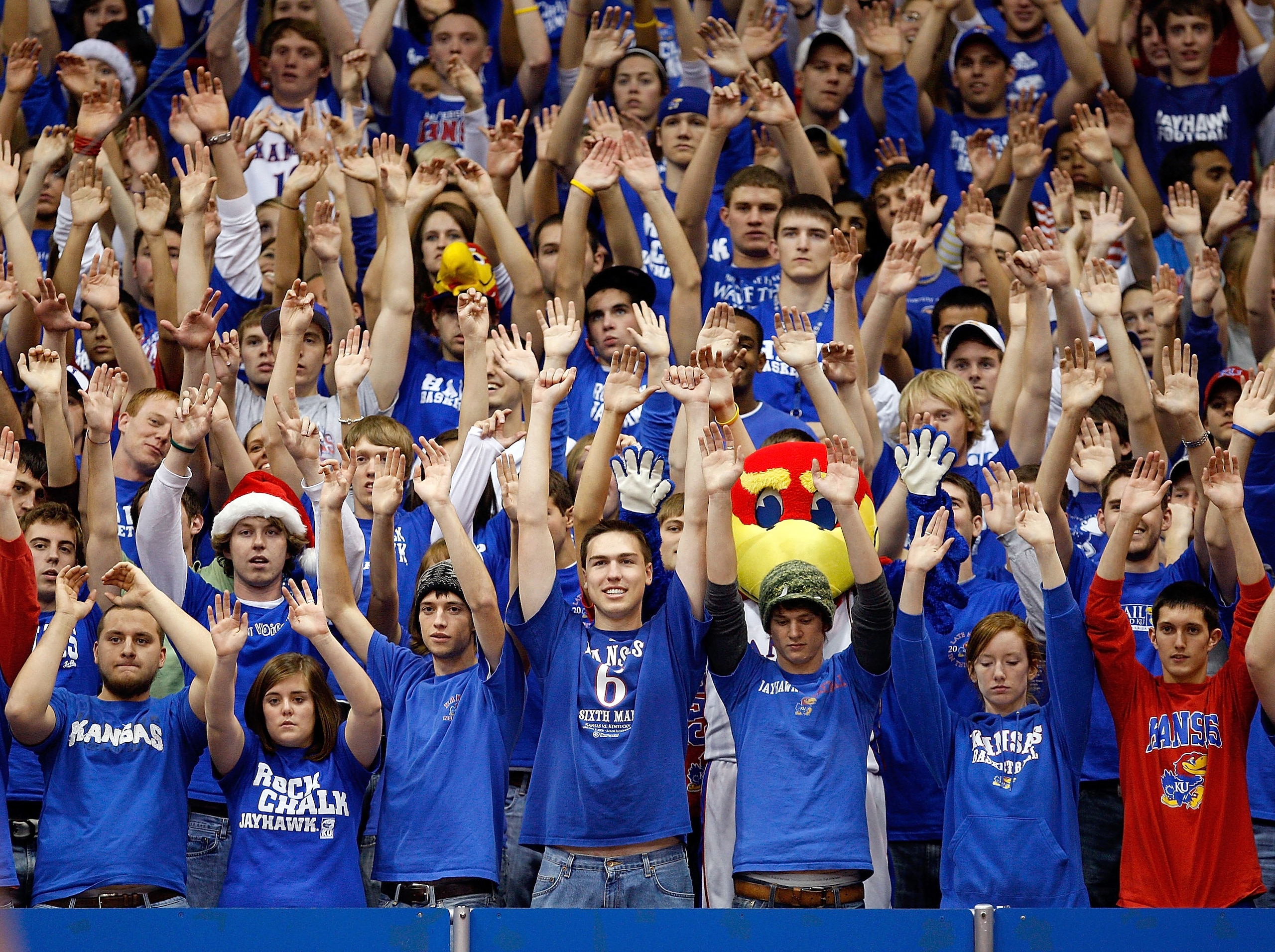 LAWRENCE, KS - DECEMBER 03: Kansas Jayhawks fans raise their arms during a free throw attempt by the opposing New Mexico State Aggies during the first half of the game on December 3, 2008 at Allen Fieldhouse in Lawrence, Kansas. (Photo by Jamie Squire/Get