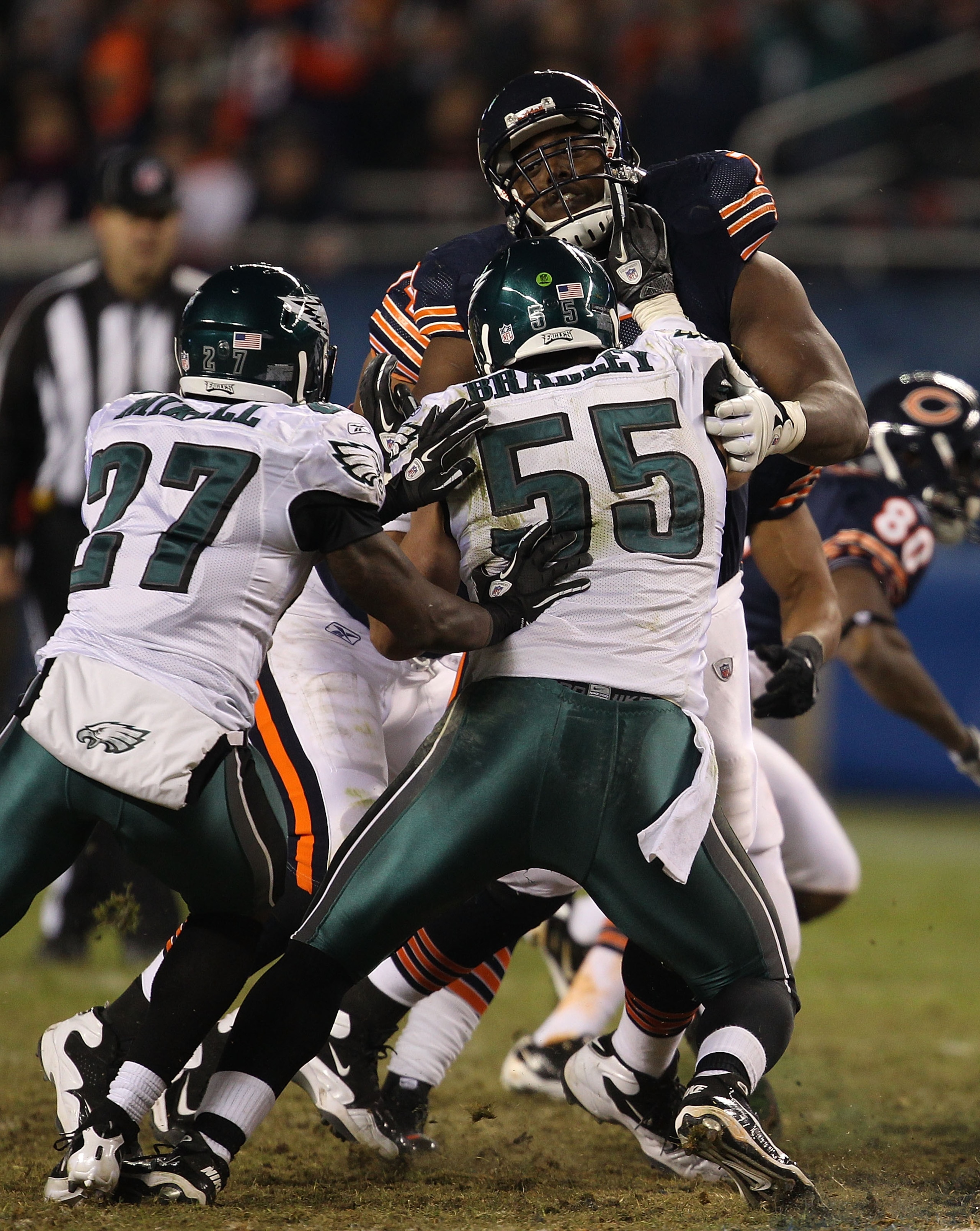 CHICAGO - NOVEMBER 28: J'Marcus Webb #73 of the Chicago Bears takes on Stewart Bradley #55 and Quintin Mikell #27 of the Philadelphia Eagles at Soldier Field on November 28, 2010 in Chicago, Illinois. The Bears defeated the Eagles 31-26. (Photo by Jonatha