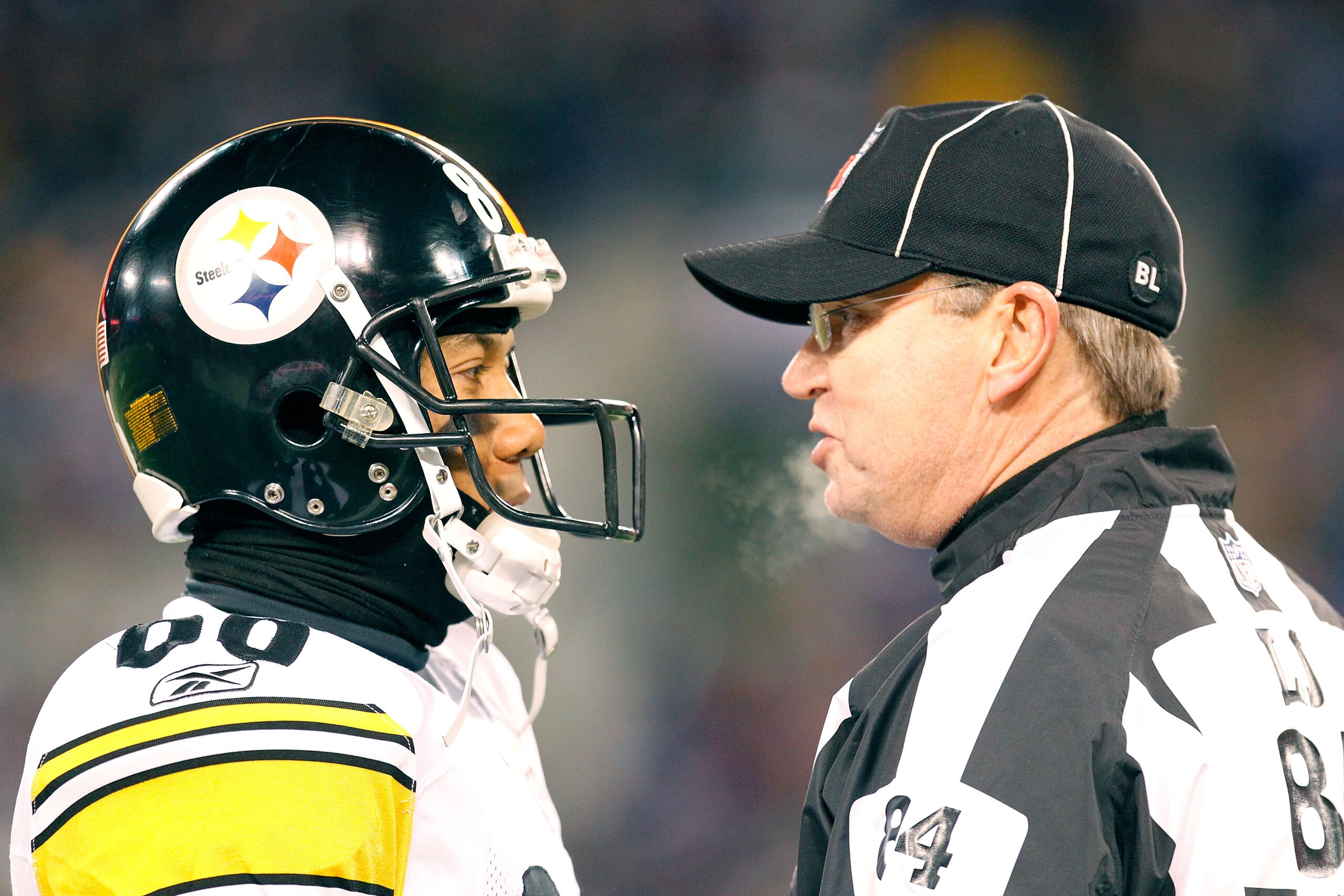 BALTIMORE, MD - DECEMBER 05:  Wide receiver Hines Ward #86 of the Pittsburgh Steelers talks to a referee during the game against the Baltimore Ravens at M&T Bank Stadium on December 5, 2010 in Baltimore, Maryland. Pittsburgh won 13-10.  (Photo by Geoff Bu