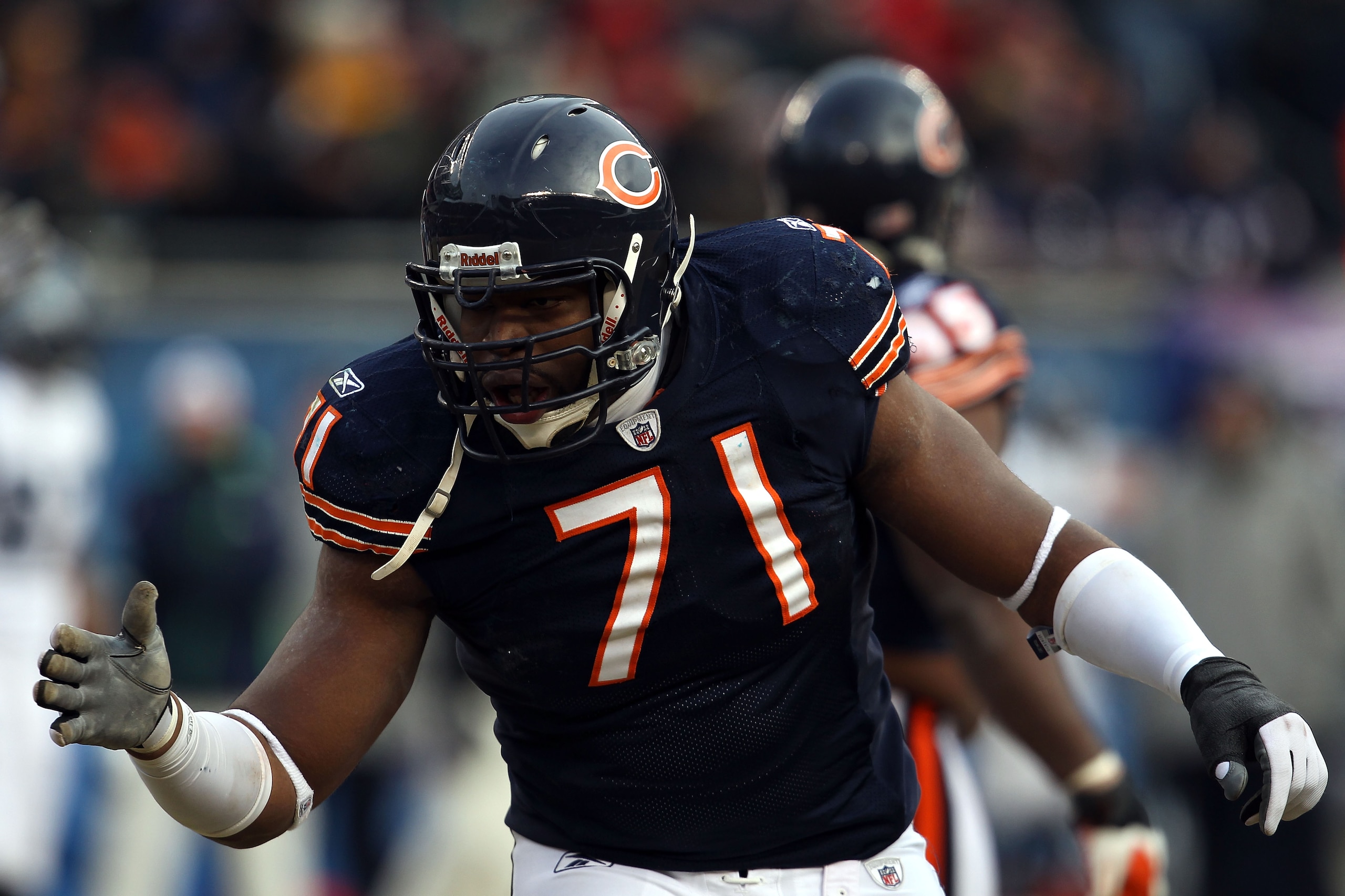 CHICAGO, IL - JANUARY 16:  Israel Idonije #71 of the Chicago Bears reacts after a Bears sack on quarterback Matt Hasselbeck #8 of the Seattle Seahawks in the second half of the 2011 NFC divisional playoff game at Soldier Field on January 16, 2011 in Chica