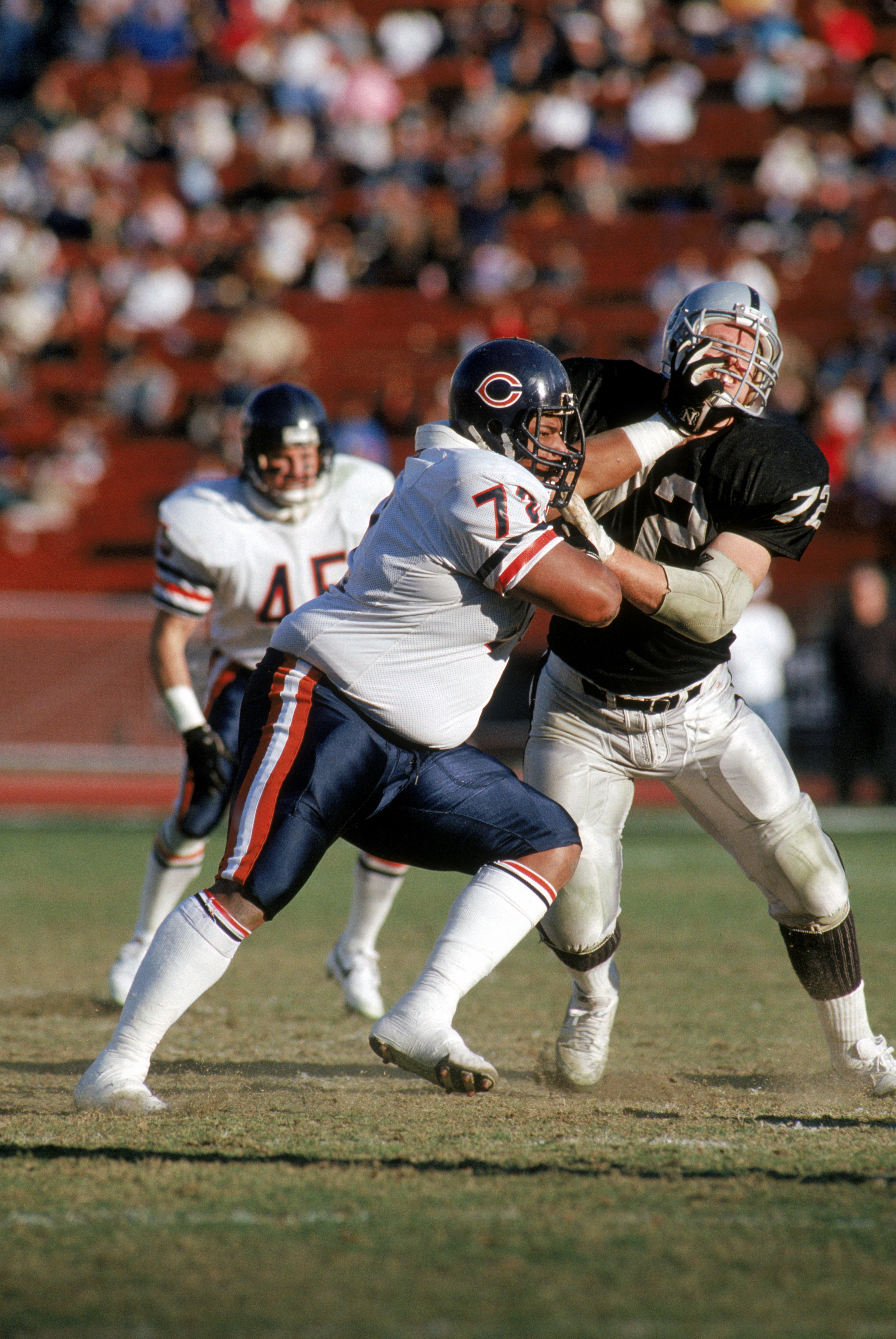 LOS ANGELES - DECEMBER 27:  Defensive tackle William Perry #72 of the Chicago Bears battles against center Don Mosebar #72 of the Los Angeles Raiders at the Los Angeles Memorial Coliseum on December 27, 1987 in Los Angeles, California.  The Bears won 6-3.