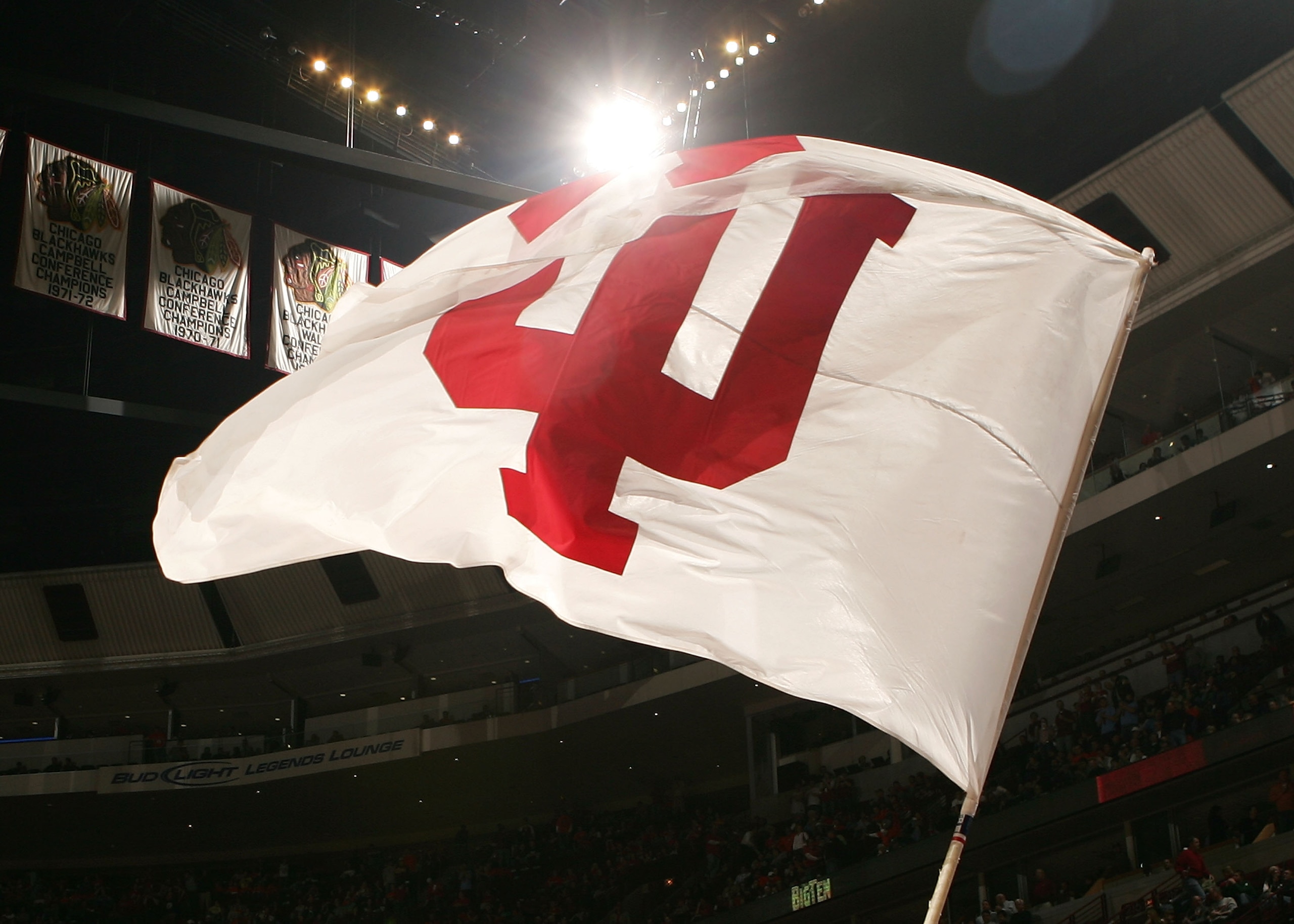 CHICAGO - MARCH 09:  A cheerleader from the Indiana Hoosiers waves a flag with Indiana's logo on the court against the Illinois Fighting Illini during the quarterfinals of the Big Ten Men's Basketball Conference Tournament March 9, 2007 at the United Cent