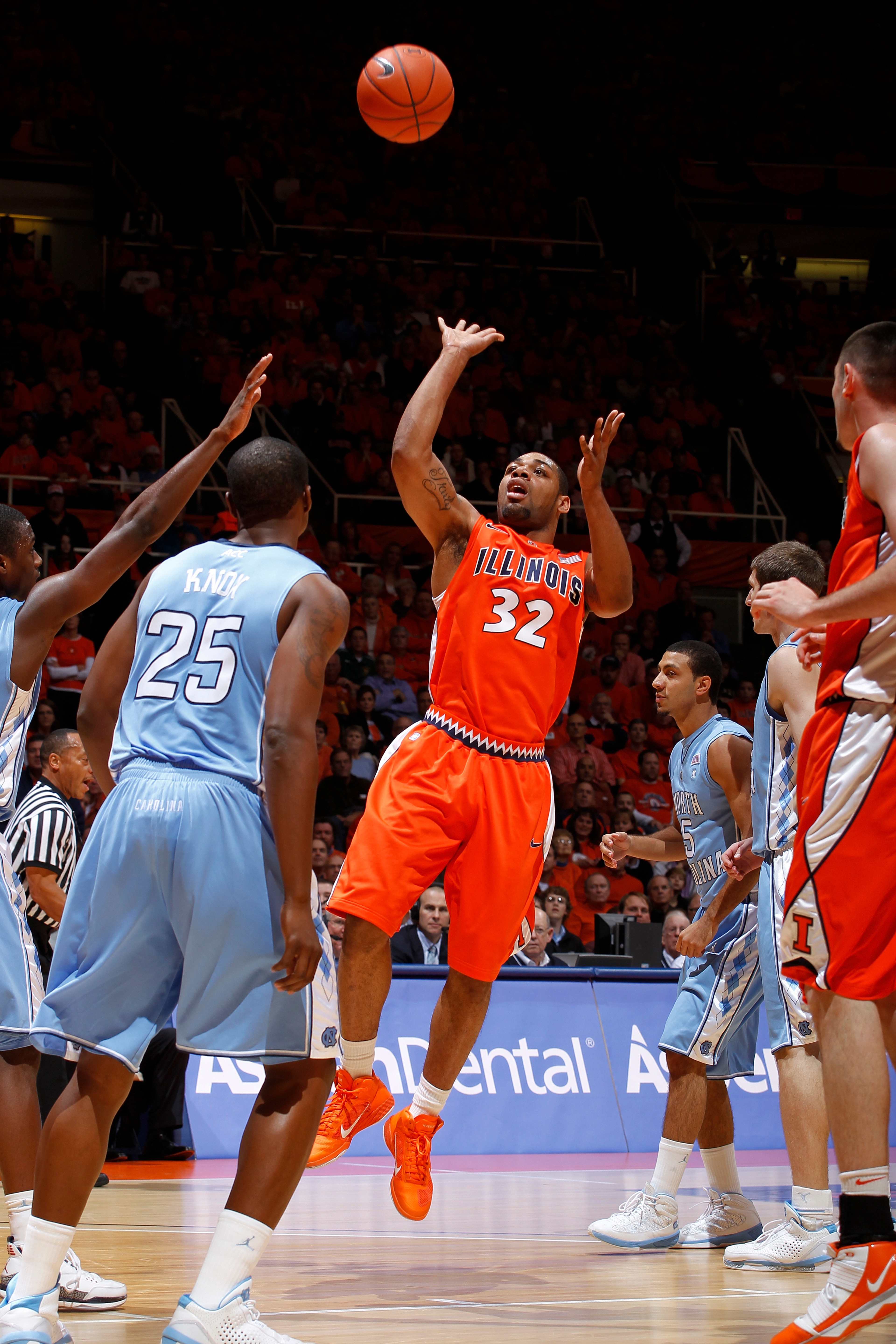 CHAMPAIGN, IL - NOVEMBER 30: Demetri McCamey #32 of the Illinois Fighting Illini puts up a shot in the lane against the North Carolina Tar Heels during the 2010 ACC/Big Ten Challenge at Assembly Hall on November 30, 2010 in Champaign, Illinois. Illinois d