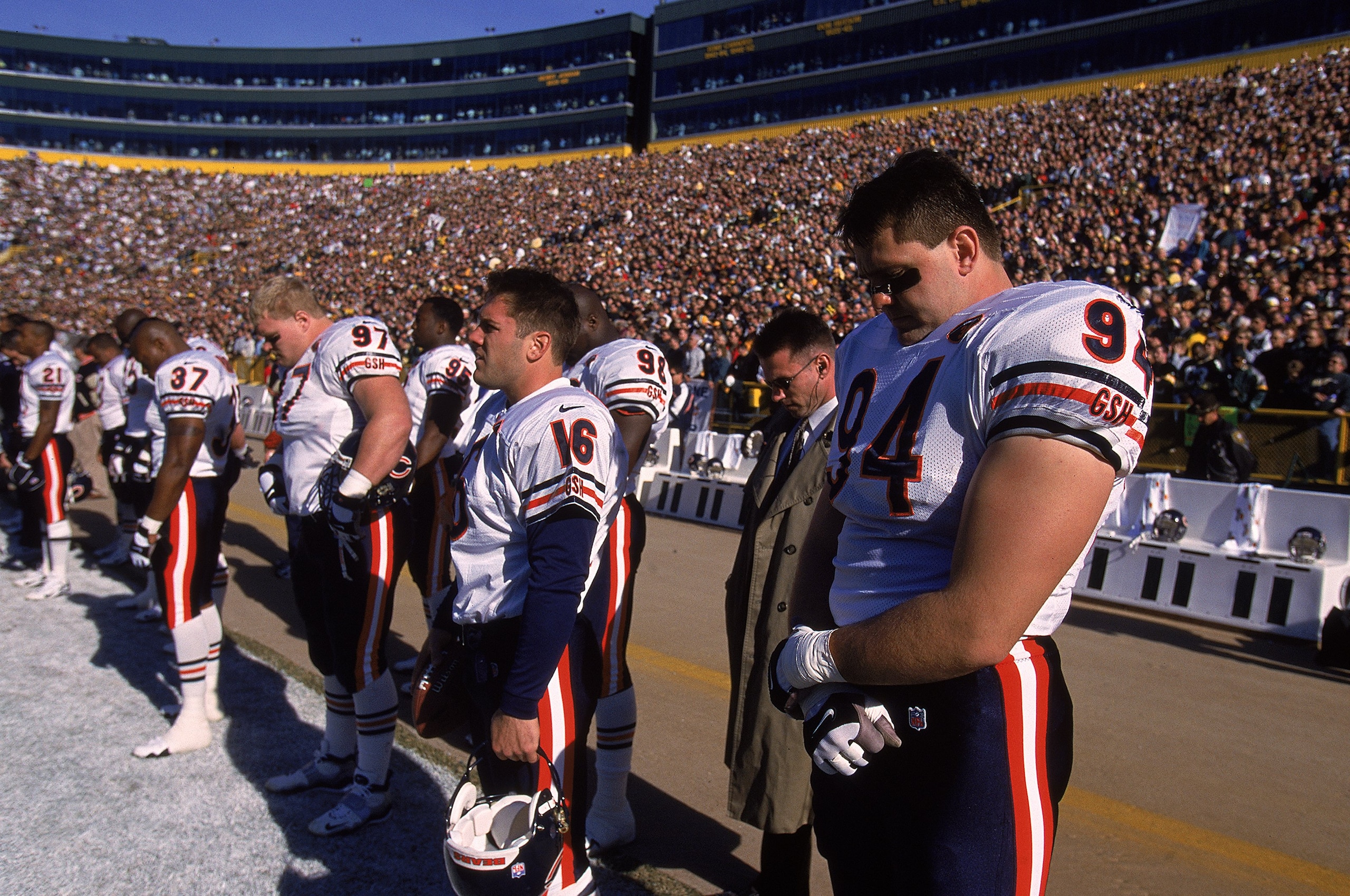 7 Nov 1999:  Shane Burton #94 of the Chicago Bears bows his head in observance of Walter Payton with his teammates before the game against the Green Bay Packers at Lambeau Field in Green Bay, Wisconsin. The Bears defeated the Packers 14-13. Mandatory Cred