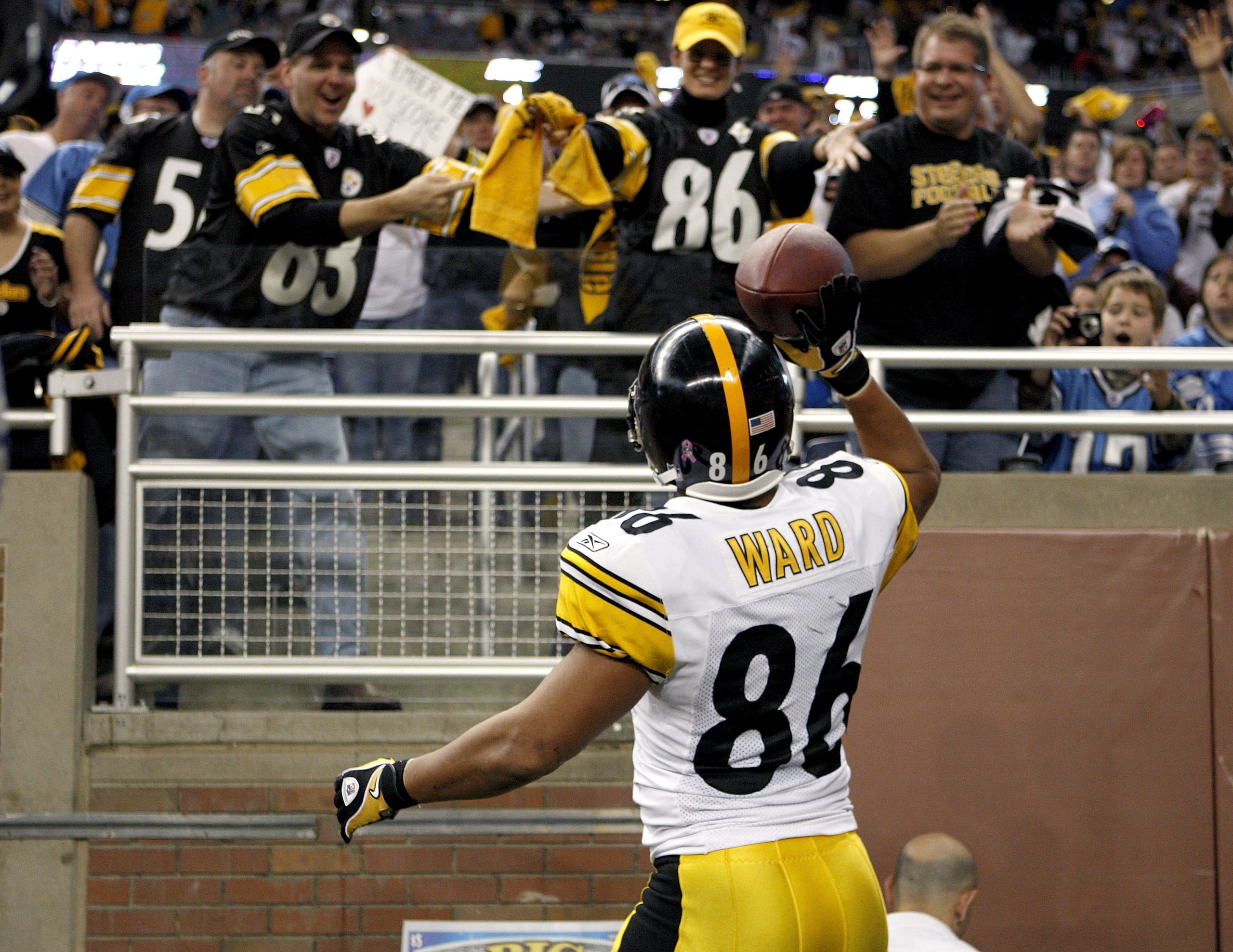DETROIT , MI - OCTOBER 11:  Hines Ward #86 of the Pittsburgh Steelers celebrates a second quarter touchdown by throwing the ball to fans while playing the Detroit Lions on October 11, 2009 at Ford Field in Detroit, Michigan.  (Photo by Gregory Shamus/Gett