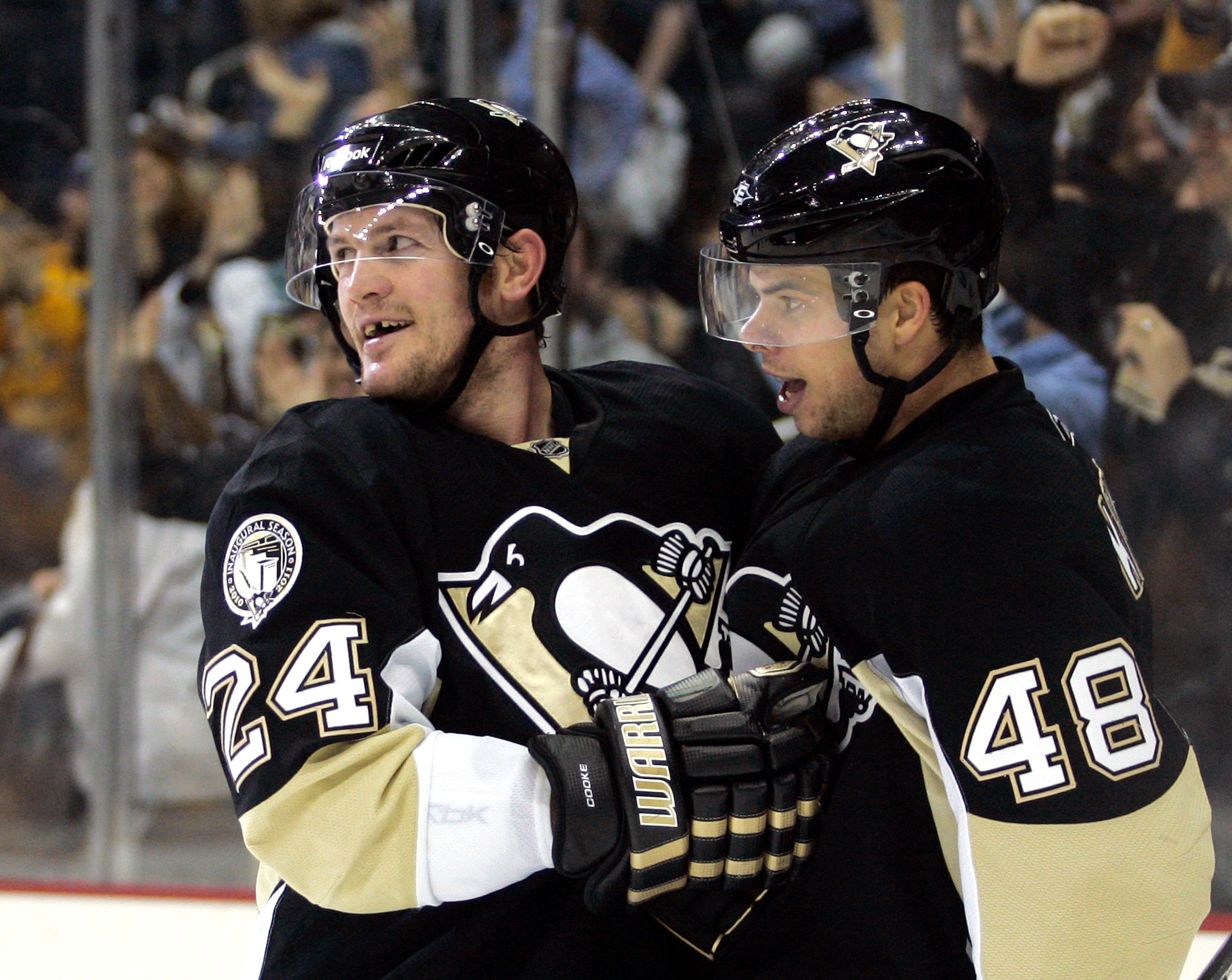 PITTSBURGH, PA - JANUARY 18:  Matt Cooke #24 of the Pittsburgh Penguins celebrates his empty net goal with Tyler Kennedy #48 against the Detroit Red Wings at Consol Energy Center on January 18, 2011 in Pittsburgh, Pennsylvania.  The Penguins defeated the 