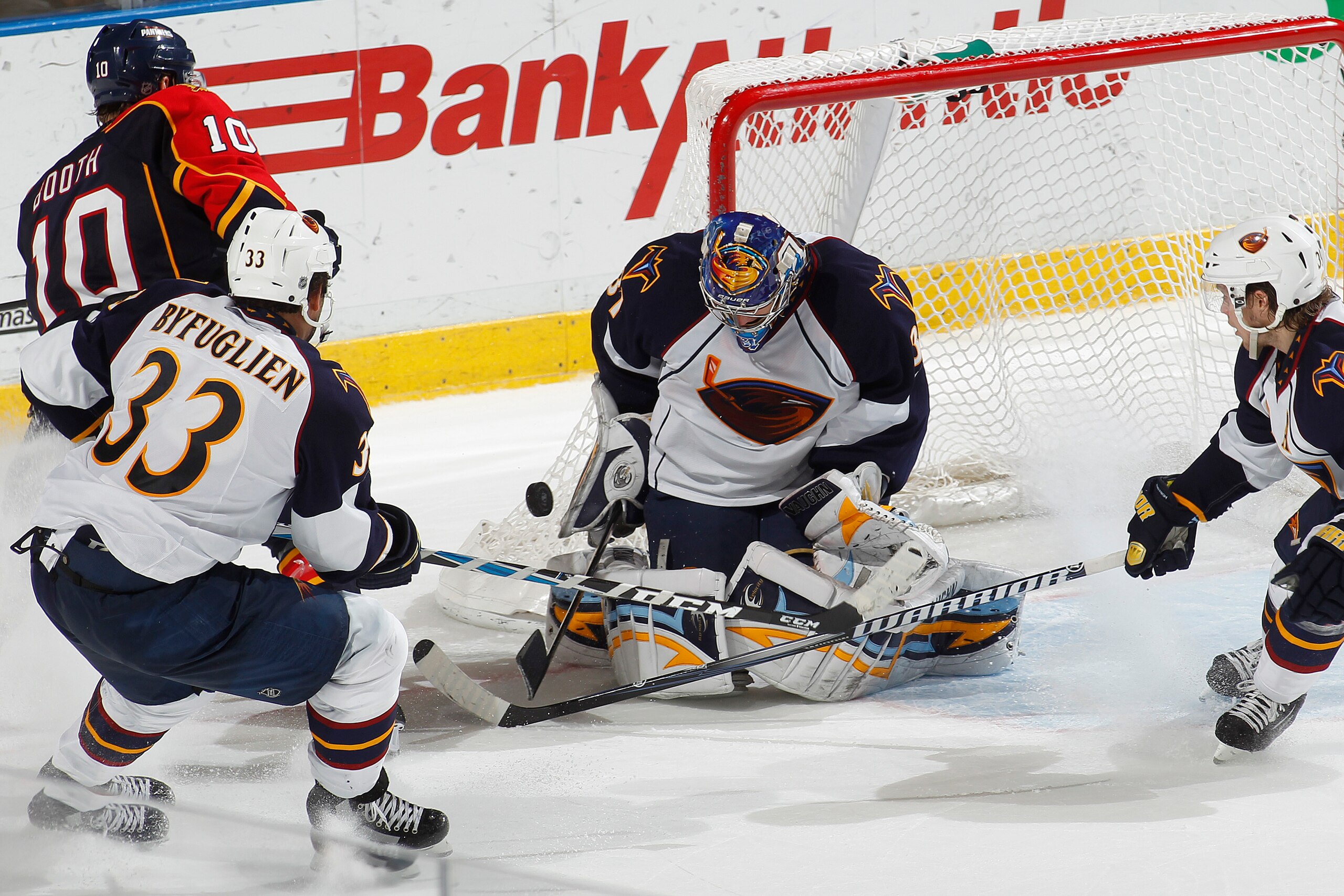 SUNRISE, FL - JANUARY 17: Goaltender Ondrej Pavelec #31 of the Atlanta Thrashers stops a shot by David Booth #10 of the Florida Panthers during the overtime period on January 17, 2011 at the BankAtlantic Center in Sunrise, Florida. The Thrashers defeated SUNRISE, FL - JANUARY 17: Goaltender Ondrej Pavelec #31 of the Atlanta Thrashers stops a shot by David Booth #10 of the Florida Panthers during the overtime period on January 17, 2011 at the BankAtlantic Center in Sunrise, Florida. The Thrashers defeated
