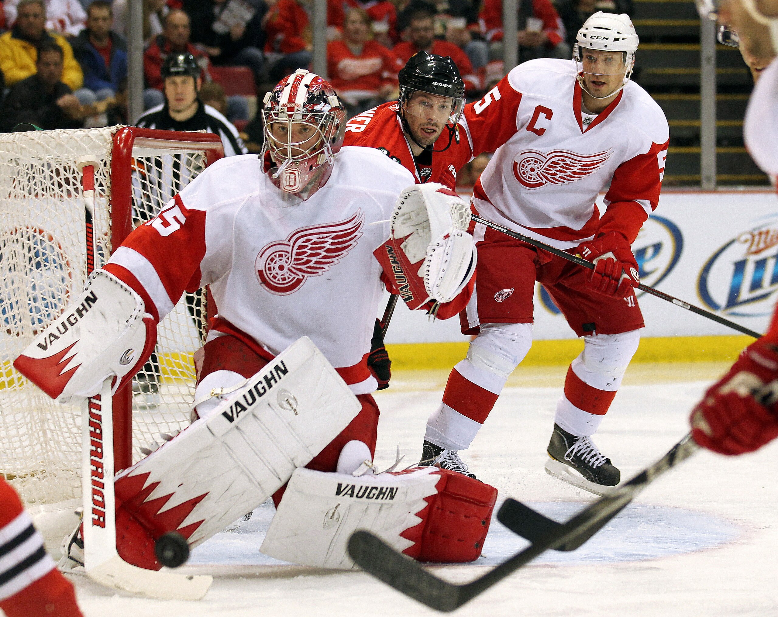 DETROIT, MI - JANUARY 22: Jimmy Howard #35 of the Detroit Red Wings keeps an eye on a puck in a game against the Chicago Black Hawks on January 22, 2011 at the Joe Louis Arena in Detroit, Michigan. The Hawks defeated the Wings 4-1. (Photo by Claus Anders DETROIT, MI - JANUARY 22: Jimmy Howard #35 of the Detroit Red Wings keeps an eye on a puck in a game against the Chicago Black Hawks on January 22, 2011 at the Joe Louis Arena in Detroit, Michigan. The Hawks defeated the Wings 4-1. (Photo by Claus Anders