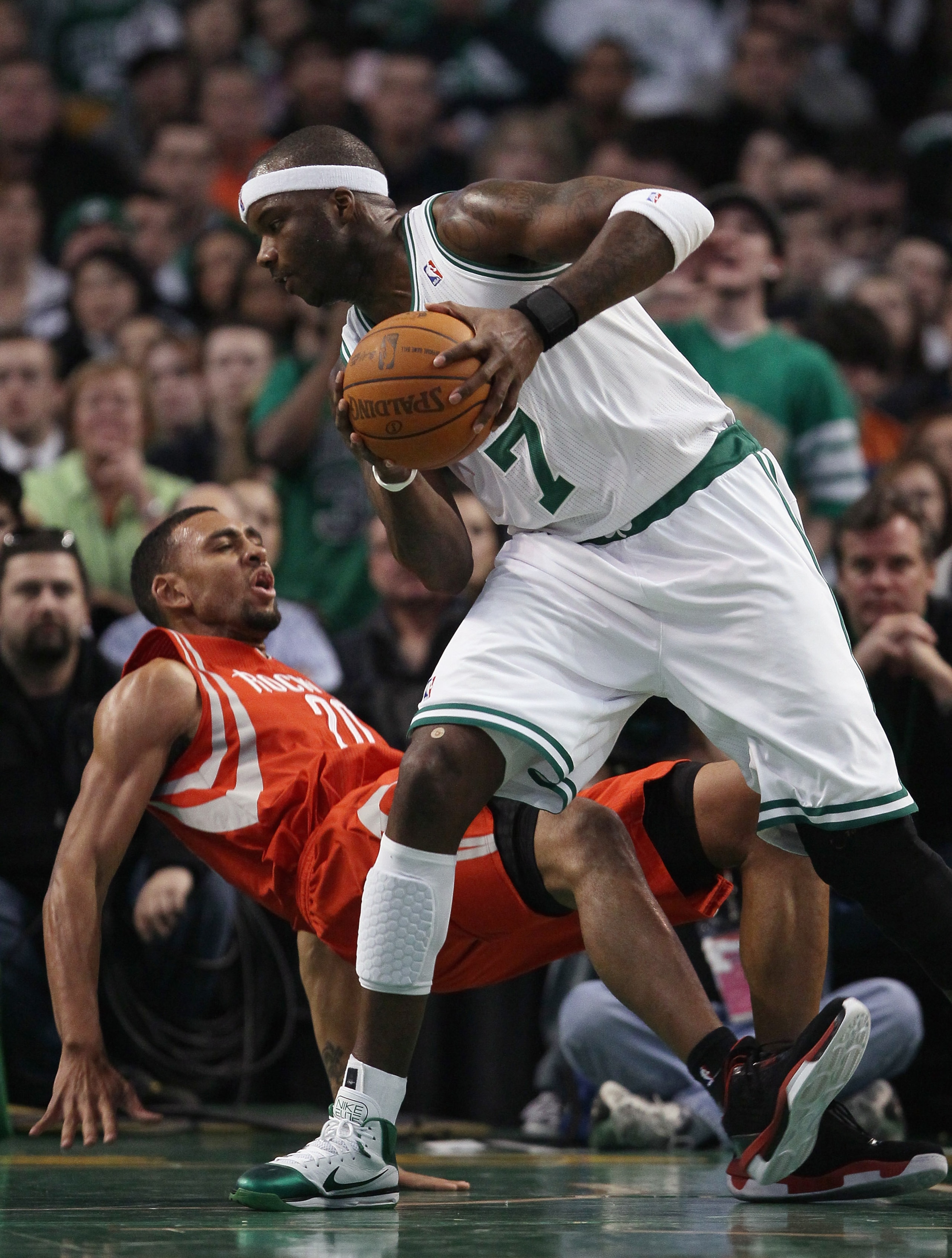 BOSTON, MA - JANUARY 10: Jermaine O'Neal #7 of the Boston Celtics heads for the basket as Jared Jeffries #20 of the Houston Rockets falls to the ground on January 10, 2011 at the TD Garden in Boston, Massachusetts. The Rockets defeated the Celtics 108-1 BOSTON, MA - JANUARY 10: Jermaine O'Neal #7 of the Boston Celtics heads for the basket as Jared Jeffries #20 of the Houston Rockets falls to the ground on January 10, 2011 at the TD Garden in Boston, Massachusetts. The Rockets defeated the Celtics 108-1