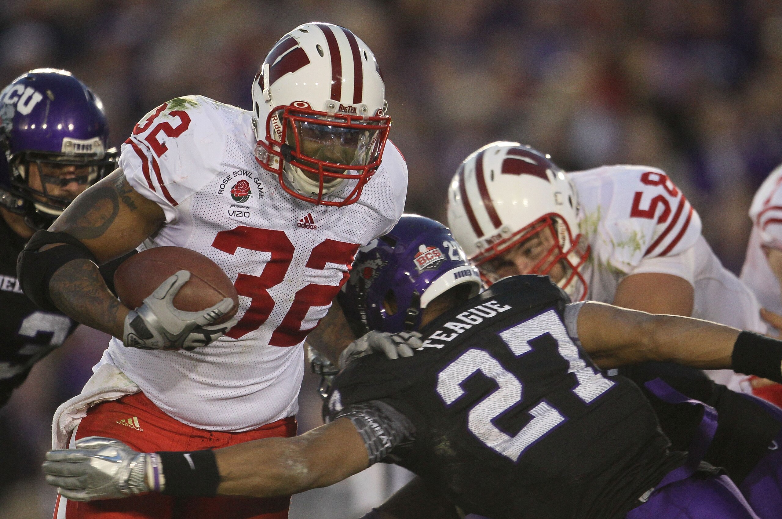 PASADENA, CA - JANUARY 01: Running back John Clay #32 of the Wisconsin Badgers rushes with the ball against the TCU Horned Frogs during the 97th Rose Bowl game on January 1, 2011 in Pasadena, California. (Photo by Jeff Gross/Getty Images) PASADENA, CA - JANUARY 01: Running back John Clay #32 of the Wisconsin Badgers rushes with the ball against the TCU Horned Frogs during the 97th Rose Bowl game on January 1, 2011 in Pasadena, California. (Photo by Jeff Gross/Getty Images)