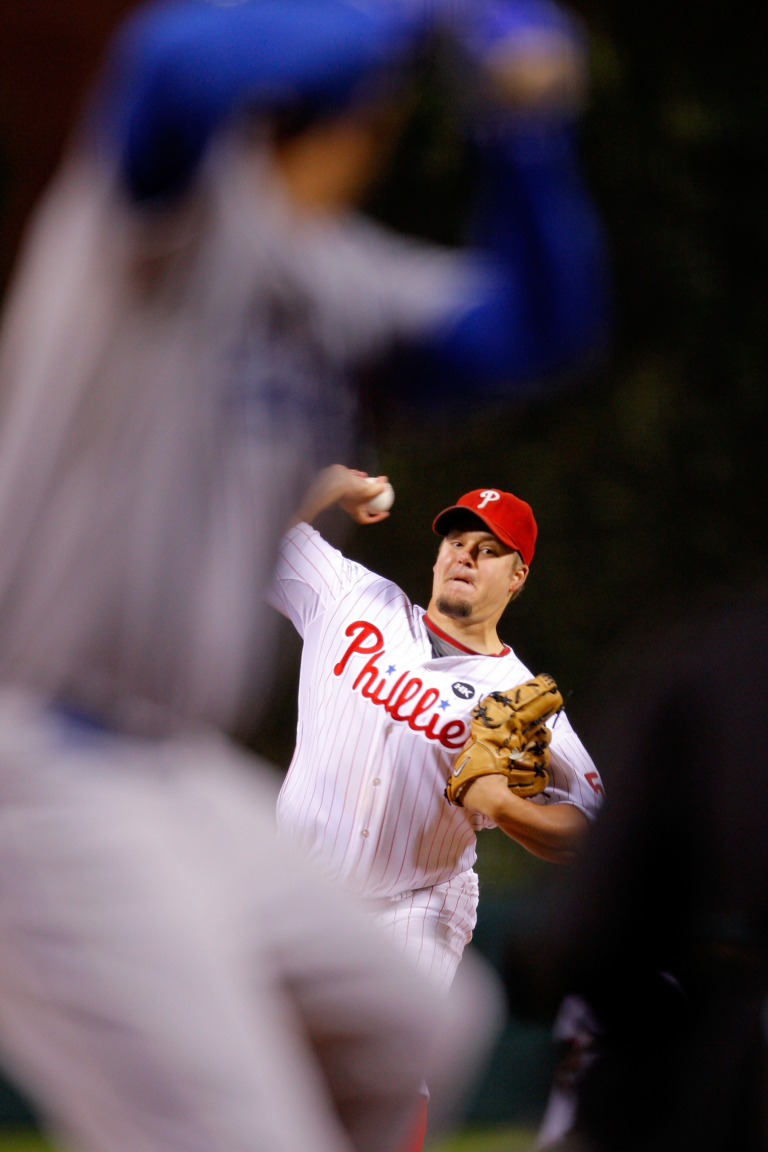 PHILADELPHIA - OCTOBER 19:  Starting pitcher Joe Blanton #56 of the Philadelphia Phillies throws a pitch against the Los Angeles Dodgers in Game Four of the NLCS during the 2009 MLB Playoffs at Citizens Bank Park on October 19, 2009 in Philadelphia, Penns