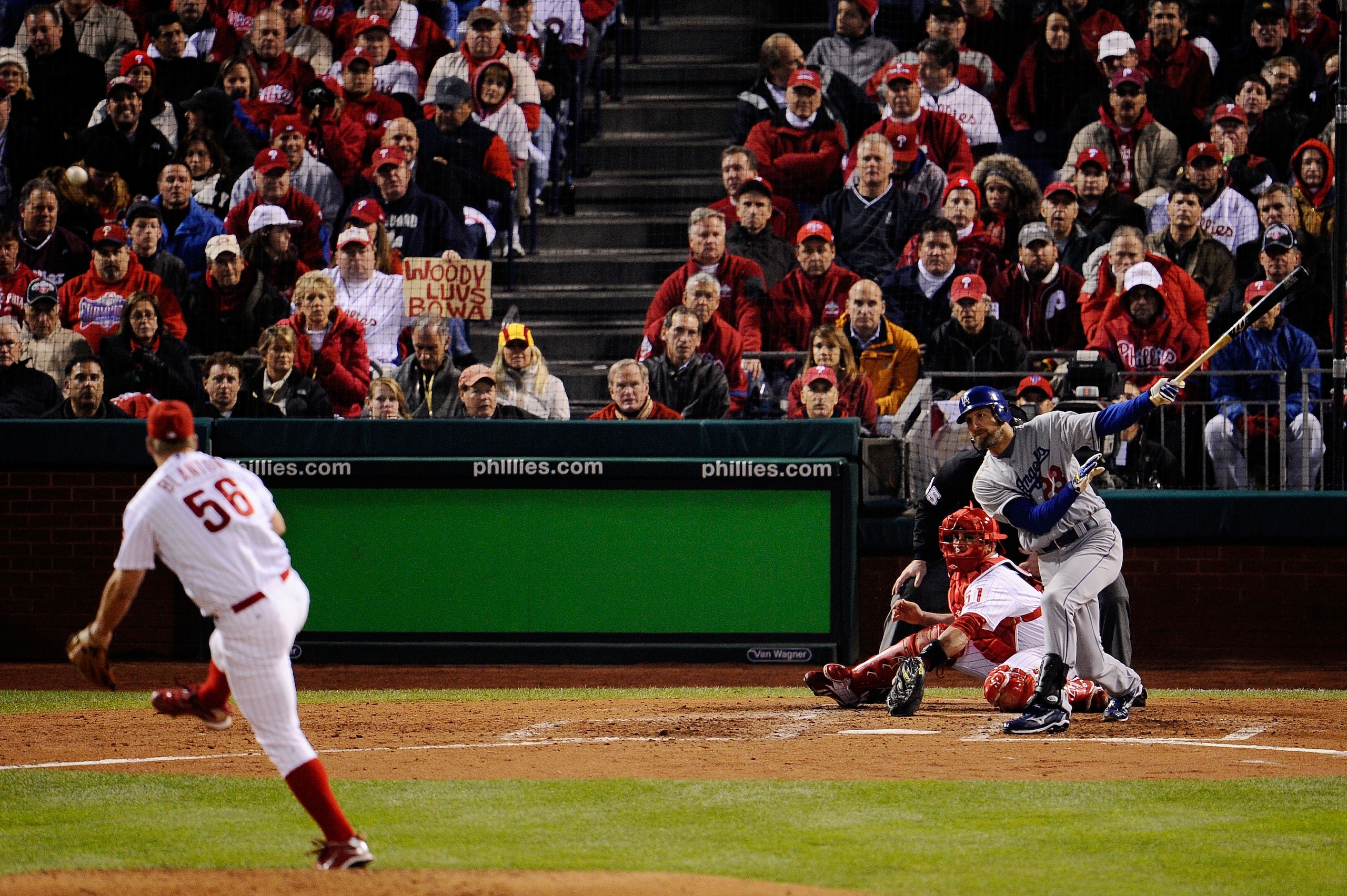 PHILADELPHIA - OCTOBER 19:  Casey Blake #23 of the Los Angeles Dodgers hits a RBI single to drive in Manny Ramirez #99 in the top of the sixth inning against Joe Blanton #56 of the Philadelphia Phillies in Game Four of the NLCS during the 2009 MLB Playoff
