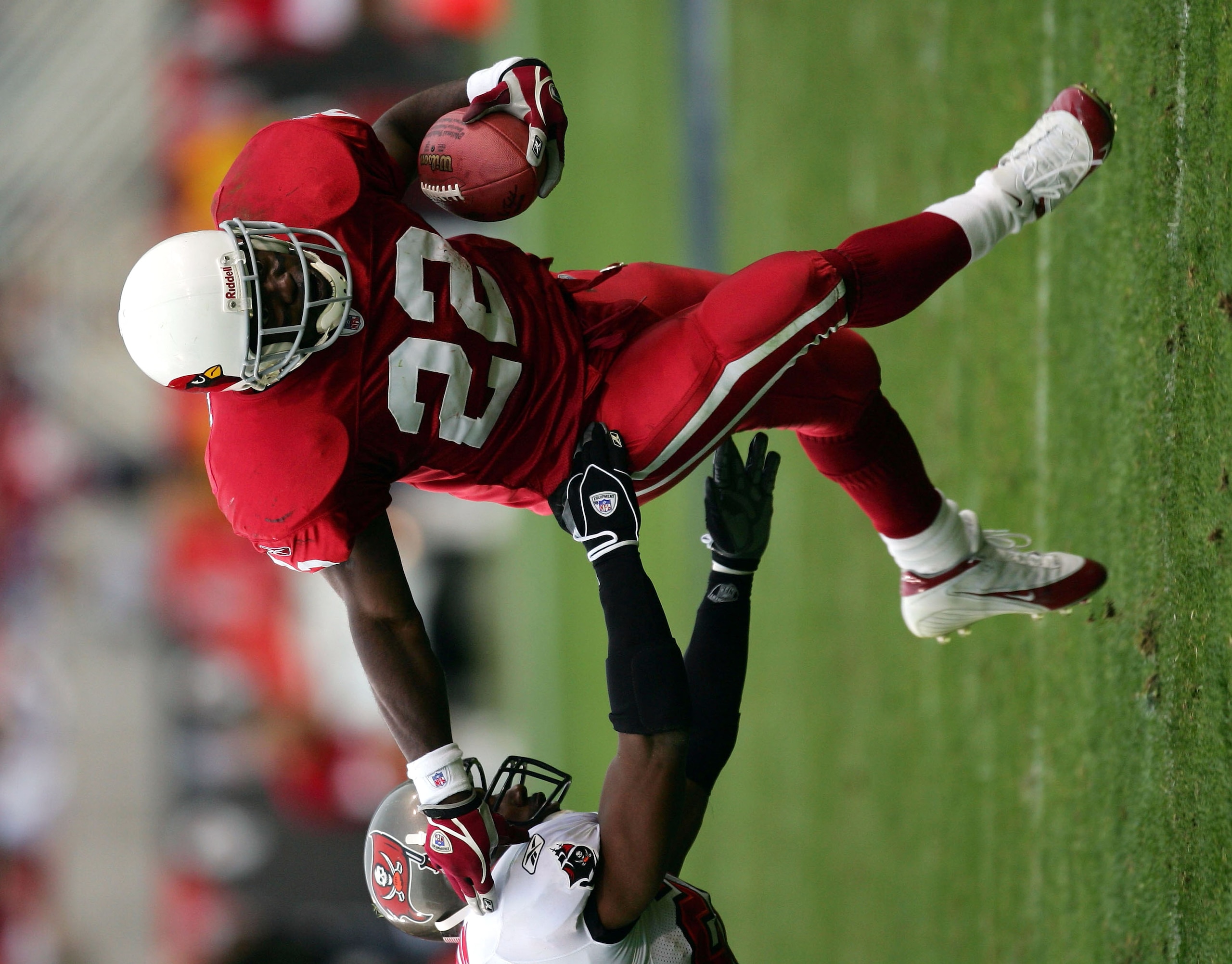 TEMPE, AZ - JANUARY 2: Emmitt Smith #22 of the Arizona Cardinals sweeps around Dexter Jackson #28 of the Tampa Bay Buccaneers in the third quarter at Sun Devil Stadium on January 2, 2005 in Tempe, Arizona. (Photo by Harry How/Getty Images) TEMPE, AZ - JANUARY 2: Emmitt Smith #22 of the Arizona Cardinals sweeps around Dexter Jackson #28 of the Tampa Bay Buccaneers in the third quarter at Sun Devil Stadium on January 2, 2005 in Tempe, Arizona. (Photo by Harry How/Getty Images)