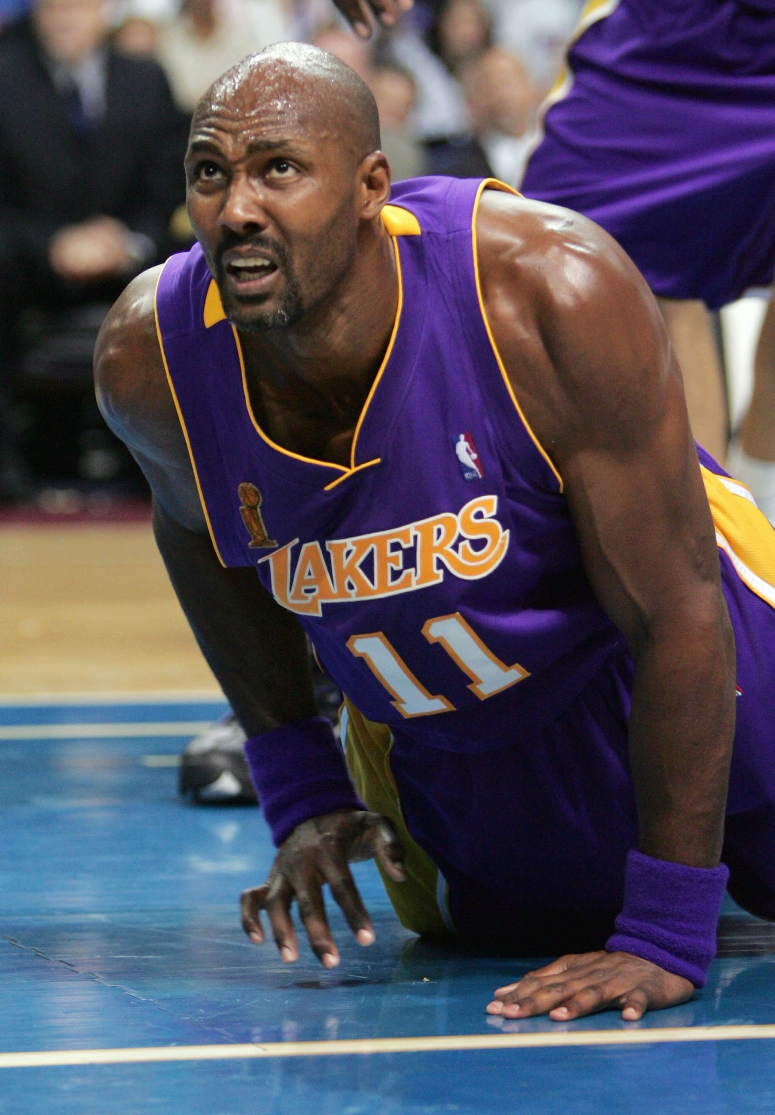 AUBURN HILLS, MI - JUNE 10: Karl Malone #11 of the Los Angeles Lakers reacts after a play against the Detroit Pistons during the second quarter of game three of the 2004 NBA Finals June 10, 2004 at The Palace of Auburn Hills in Auburn Hills, Michigan. N AUBURN HILLS, MI - JUNE 10: Karl Malone #11 of the Los Angeles Lakers reacts after a play against the Detroit Pistons during the second quarter of game three of the 2004 NBA Finals June 10, 2004 at The Palace of Auburn Hills in Auburn Hills, Michigan. N