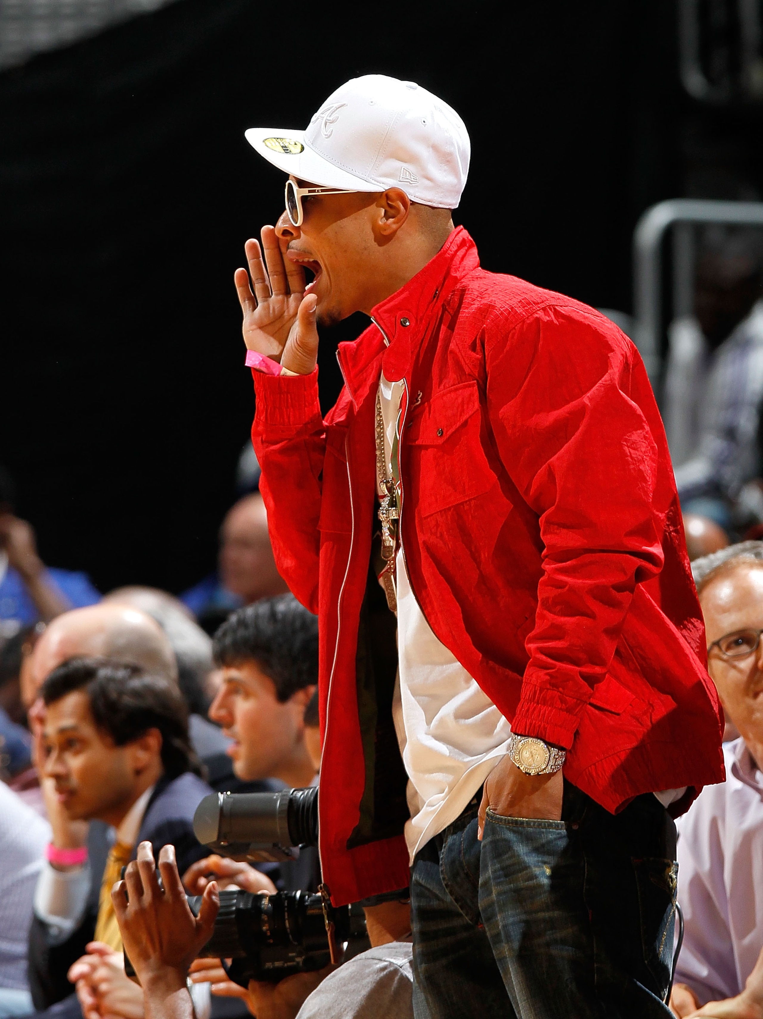 ATLANTA - MARCH 31:  Rapper T.I. cheers during the game between the Los Angeles Lakers and the Atlanta Hawks at Philips Arena on March 31, 2010 in Atlanta, Georgia.  NOTE TO USER: User expressly acknowledges and agrees that, by downloading and/or using th