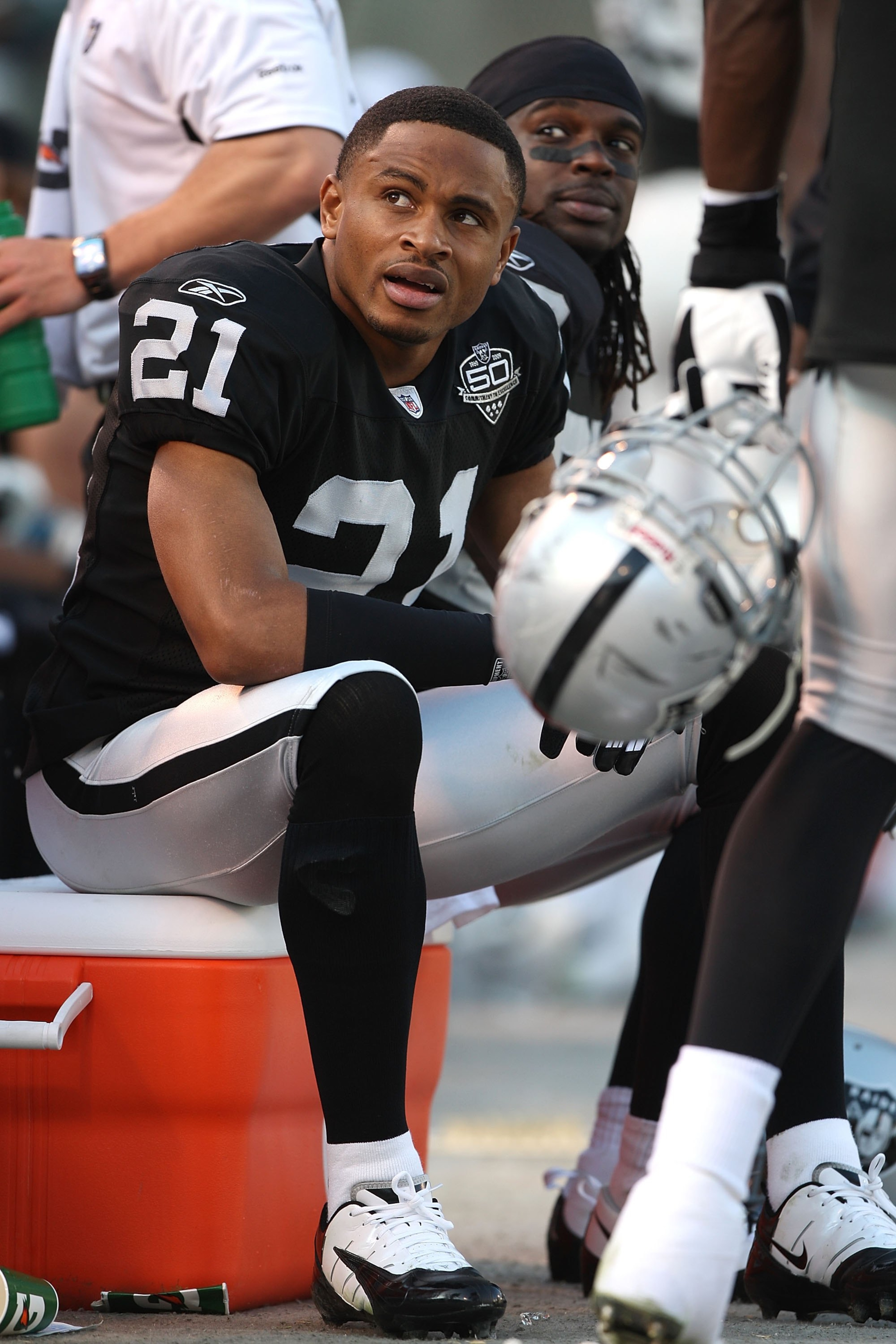 OAKLAND, CA - JANUARY 03: Nnamdi Asomugha #21 of the Oakland Raiders sits on the bench against the Baltimore Ravens during an NFL game at Oakland-Alameda County Coliseum on January 3, 2010 in Oakland, California. (Photo by Jed Jacobsohn/Getty Images) OAKLAND, CA - JANUARY 03: Nnamdi Asomugha #21 of the Oakland Raiders sits on the bench against the Baltimore Ravens during an NFL game at Oakland-Alameda County Coliseum on January 3, 2010 in Oakland, California. (Photo by Jed Jacobsohn/Getty Images)