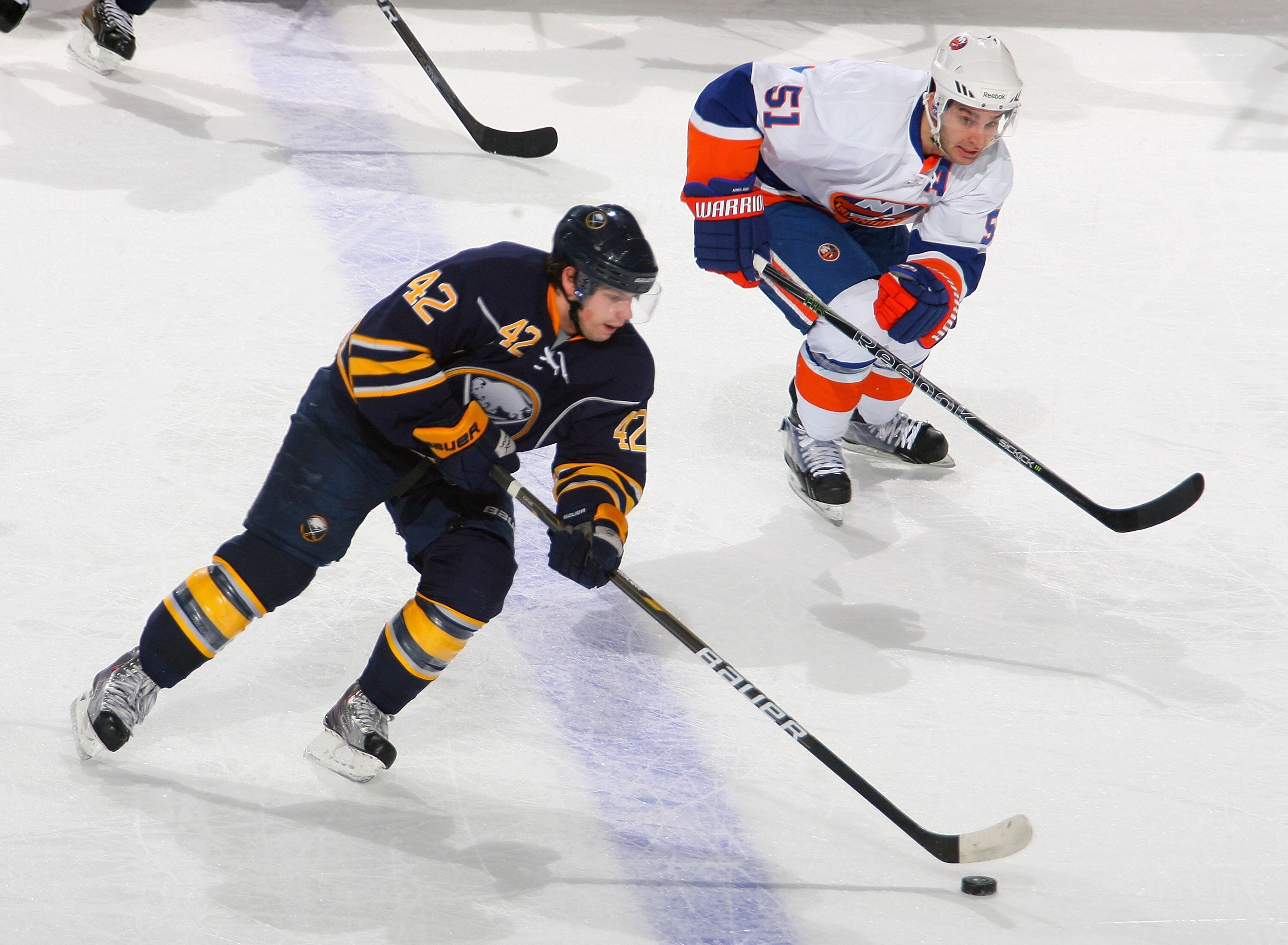 BUFFALO, NY - JANUARY 21: Nathan Gerbe #42 of the Buffalo Sabres skates against Frans Nielsen #51 of the New York Islanders at HSBC Arena on January 21, 2011 in Buffalo, New York.  (Photo by Rick Stewart/Getty Images)