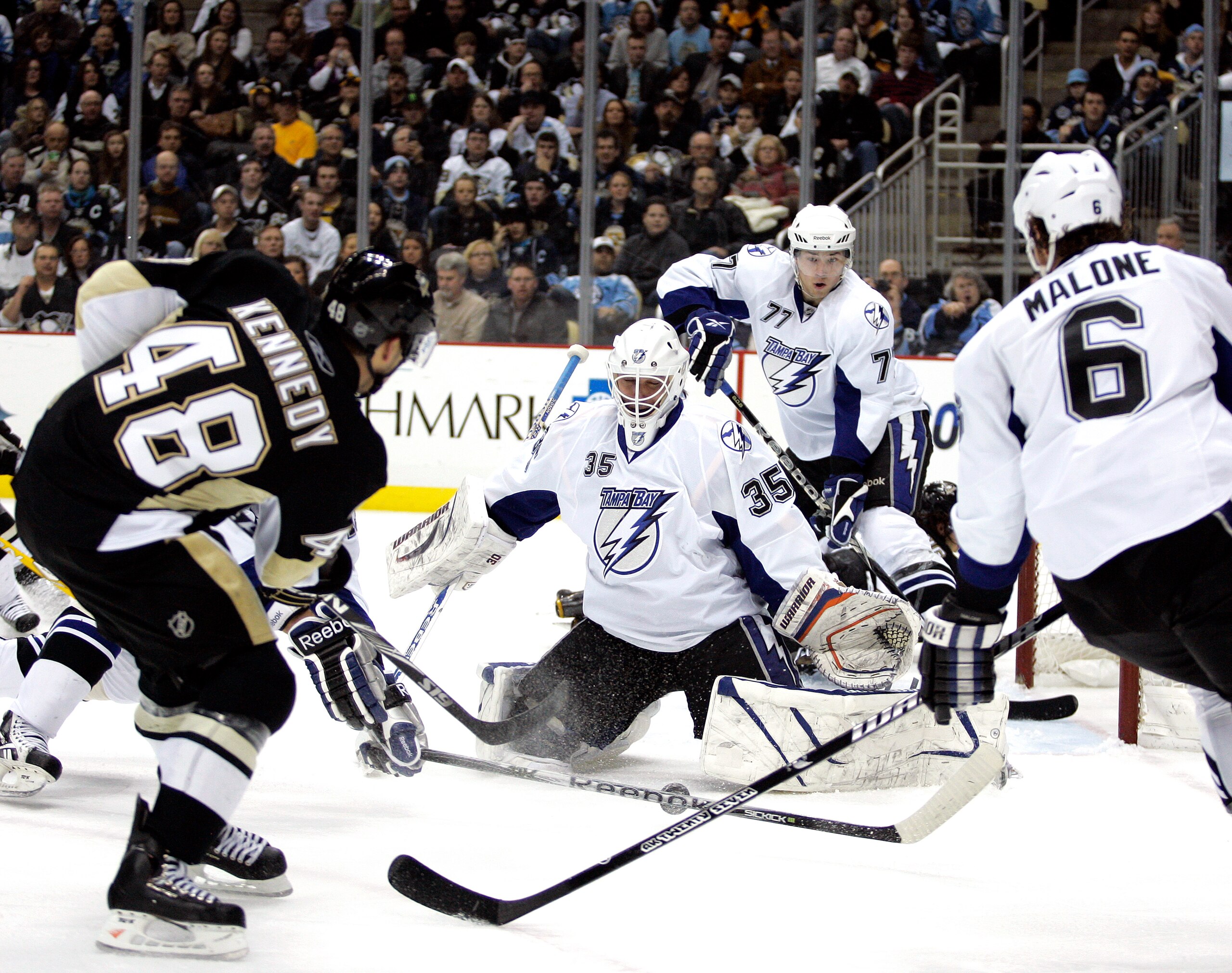 PITTSBURGH, PA - JANUARY 05: Tyler Kennedy #48 of the Pittsburgh Penguins shoots and scores past Dwayne Roloson #35 of the Tampa Bay Lightning on January 5, 2011 at Consol Energy Center in Pittsburgh, Pennsylvania. (Photo by Justin K. Aller/Getty Images PITTSBURGH, PA - JANUARY 05: Tyler Kennedy #48 of the Pittsburgh Penguins shoots and scores past Dwayne Roloson #35 of the Tampa Bay Lightning on January 5, 2011 at Consol Energy Center in Pittsburgh, Pennsylvania. (Photo by Justin K. Aller/Getty Images