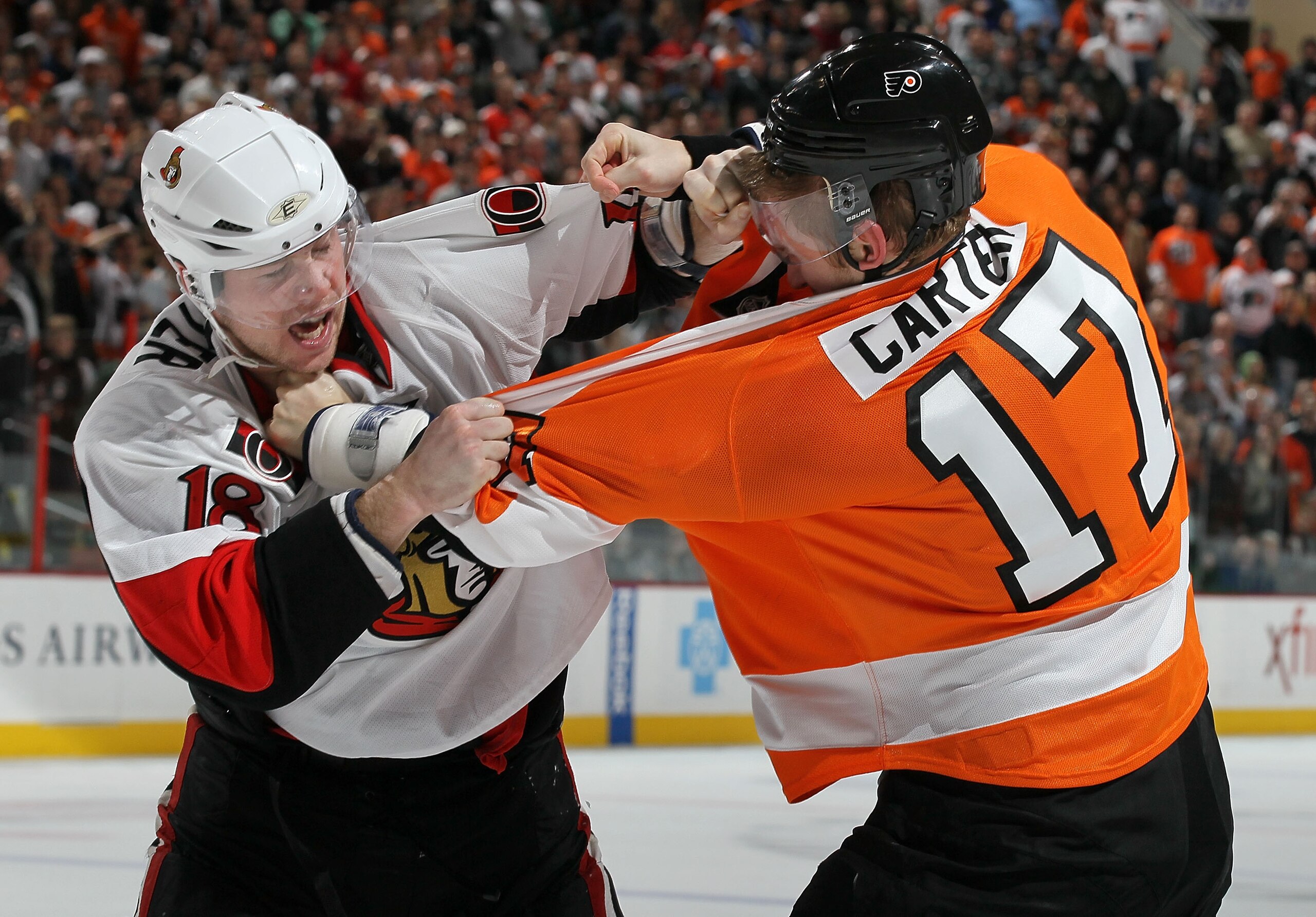 PHILADELPHIA, PA - JANUARY 20: Jesse Winchester #18 of the Ottawa Senators squares off with Jeff Carter #17 of the Philadelphia Flyers during the third period on January 20, 2011 at Wells Fargo Center in Philadelphia, Pennsylvania. The Flyers defeated th PHILADELPHIA, PA - JANUARY 20: Jesse Winchester #18 of the Ottawa Senators squares off with Jeff Carter #17 of the Philadelphia Flyers during the third period on January 20, 2011 at Wells Fargo Center in Philadelphia, Pennsylvania. The Flyers defeated th
