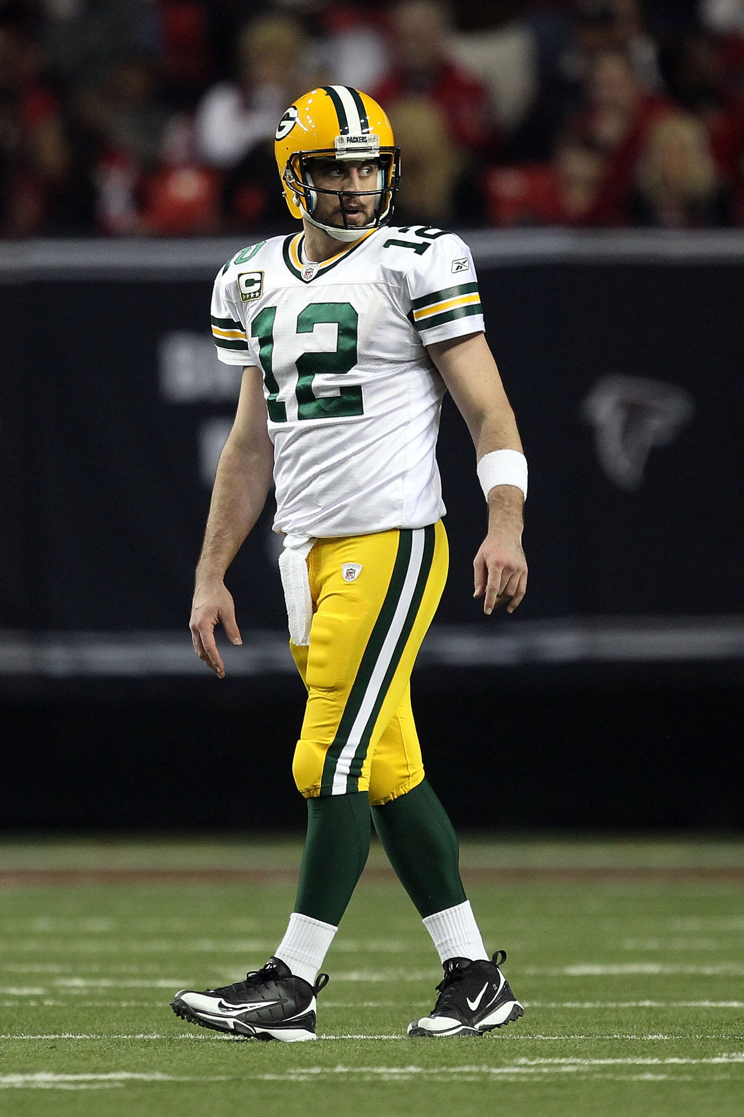 ATLANTA, GA - JANUARY 15: Aaron Rodgers #12 of the Green Bay Packers looks on against the Atlanta Falcons during their 2011 NFC divisional playoff game at Georgia Dome on January 15, 2011 in Atlanta, Georgia. The Packers won 48-21. (Photo by Streeter Le ATLANTA, GA - JANUARY 15: Aaron Rodgers #12 of the Green Bay Packers looks on against the Atlanta Falcons during their 2011 NFC divisional playoff game at Georgia Dome on January 15, 2011 in Atlanta, Georgia. The Packers won 48-21. (Photo by Streeter Le