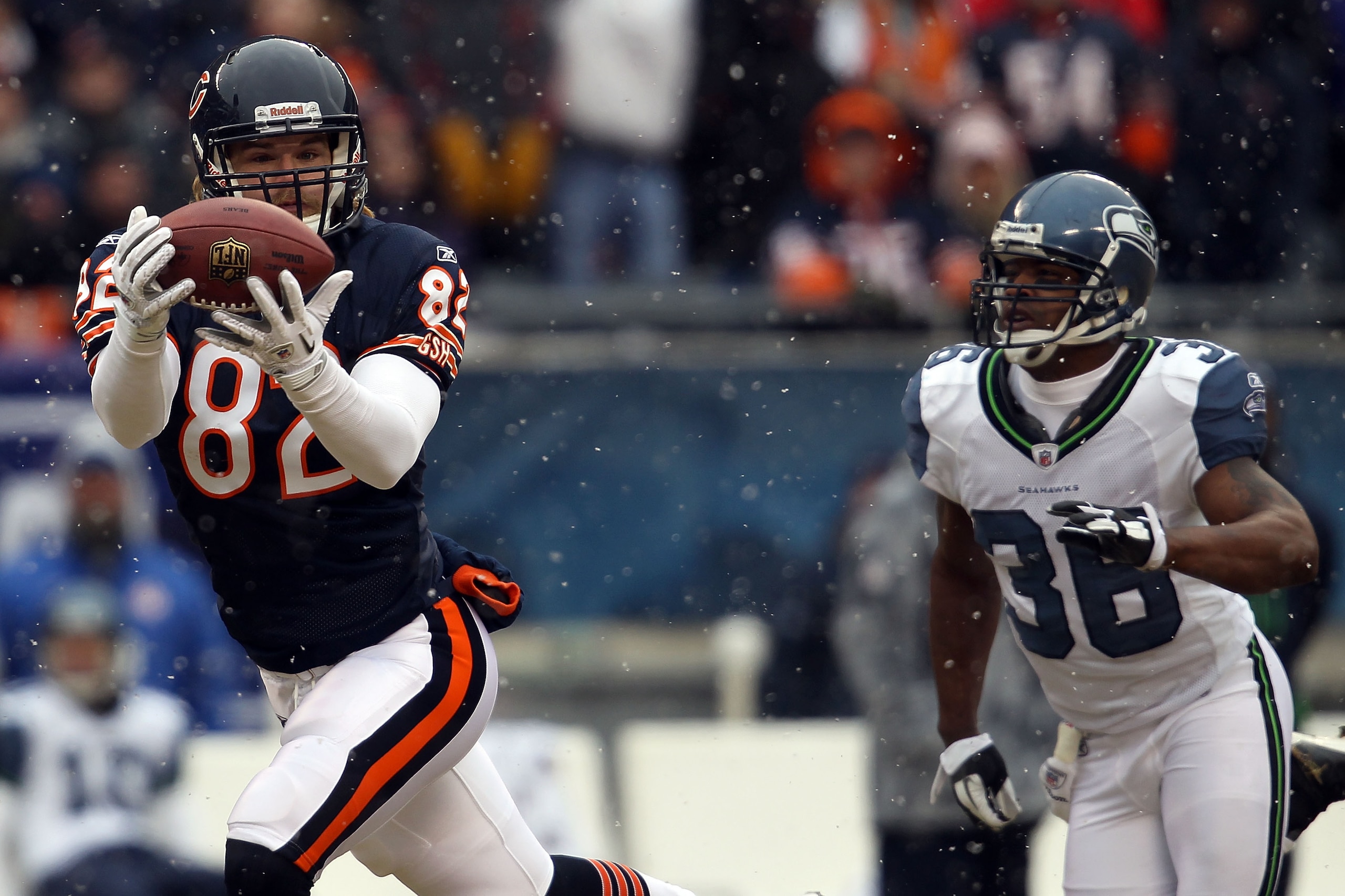 CHICAGO, IL - JANUARY 16: Tight end Greg Olsen #82 of the Chicago Bears catches a 58-yard touchdown in the first quarter in front of Lawyer Milloy #36 of the Seattle Seahawks in the 2011 NFC divisional playoff game at Soldier Field on January 16, 2011 in CHICAGO, IL - JANUARY 16: Tight end Greg Olsen #82 of the Chicago Bears catches a 58-yard touchdown in the first quarter in front of Lawyer Milloy #36 of the Seattle Seahawks in the 2011 NFC divisional playoff game at Soldier Field on January 16, 2011 in