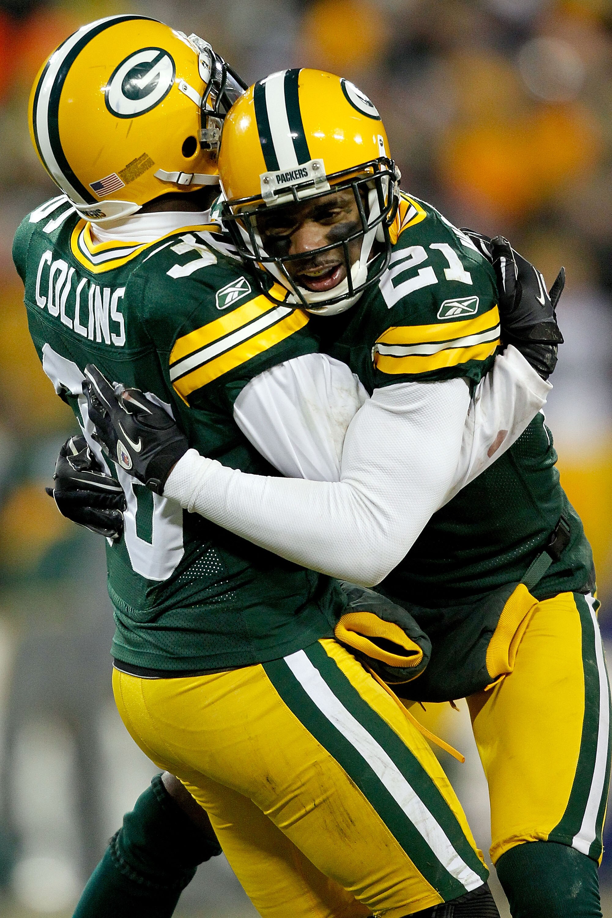 GREEN BAY, WI - JANUARY 02:  Nick Collins #36 of the Green Bay Packers is congratulated by Charles Woodson #21 after making an interception against the Chicago Bears to end their final drive in the fourth quarter at Lambeau Field on January 2, 2011 in Gre