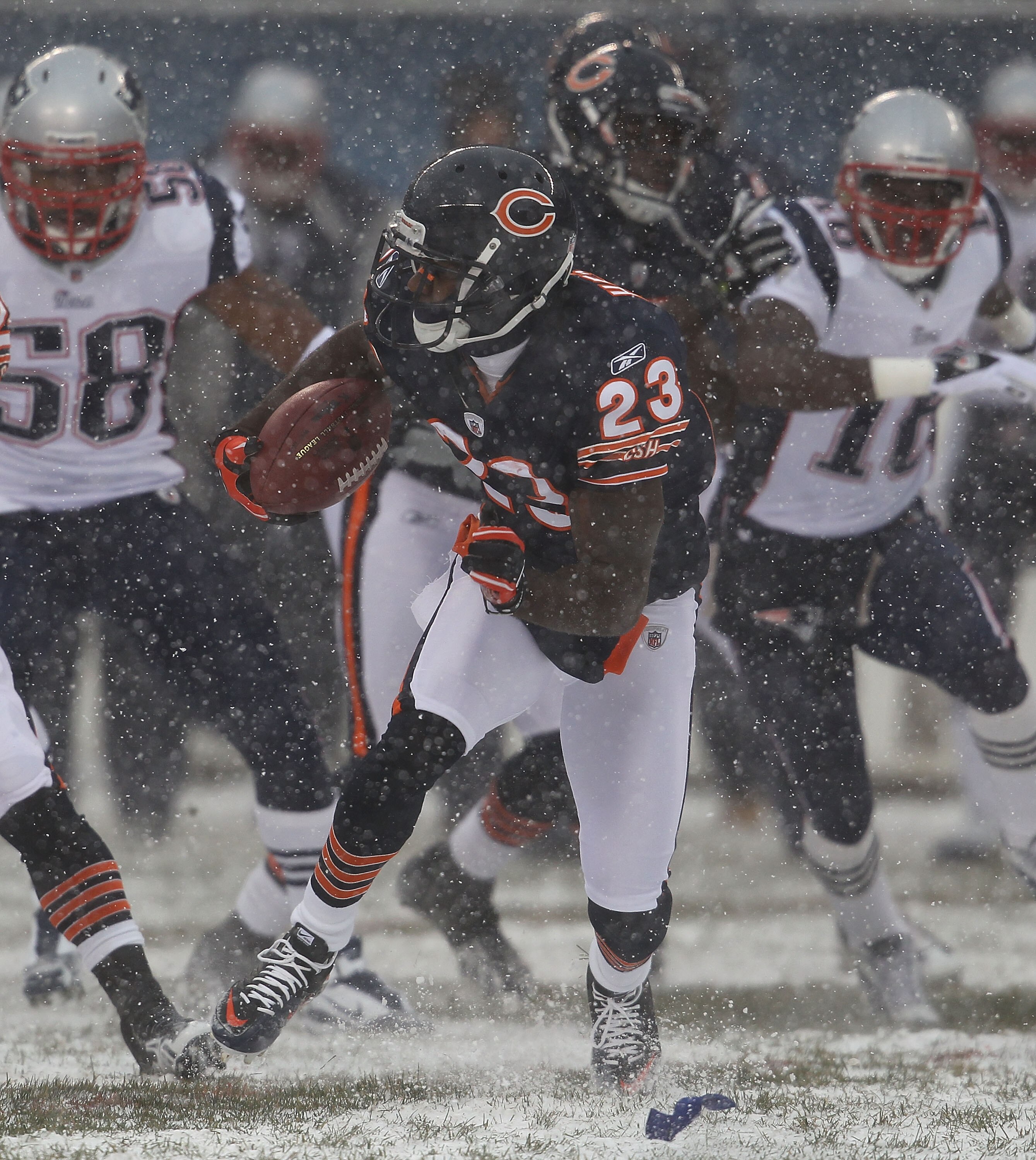 CHICAGO, IL - DECEMBER 12: Devin Hester #23 of the Chicago Bears runs after fielding a punt against the New England Patriots at Soldier Field on December 12, 2010 in Chicago, Illinois. The Patriots defeated the Bears 36-7. (Photo by Jonathan Daniel/Getty