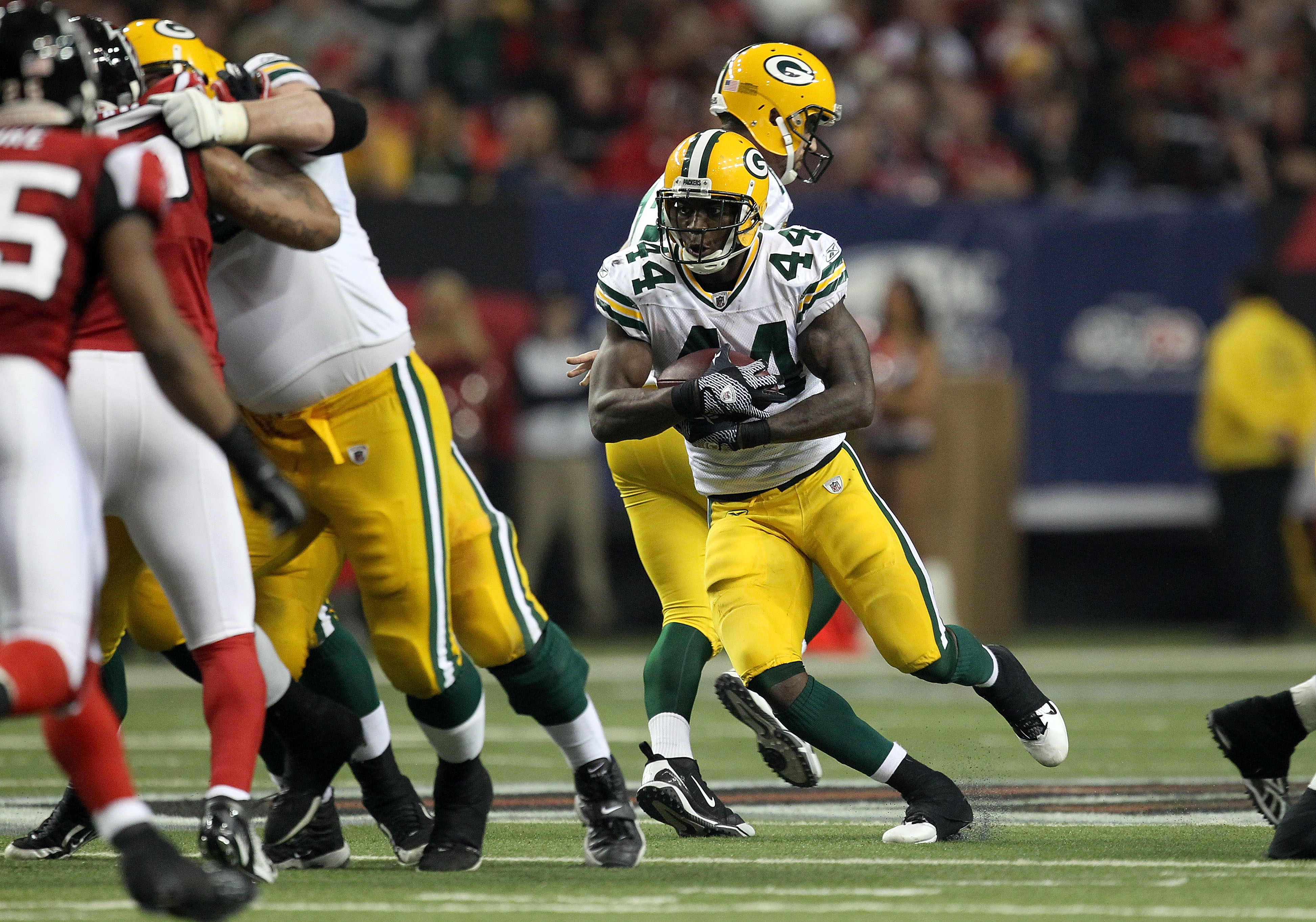 ATLANTA, GA - JANUARY 15:  James Starks #44 of the Green Bay Packers runs the ball against the Atlanta Falcons during their 2011 NFC divisional playoff game at Georgia Dome on January 15, 2011 in Atlanta, Georgia.  (Photo by Streeter Lecka/Getty Images)