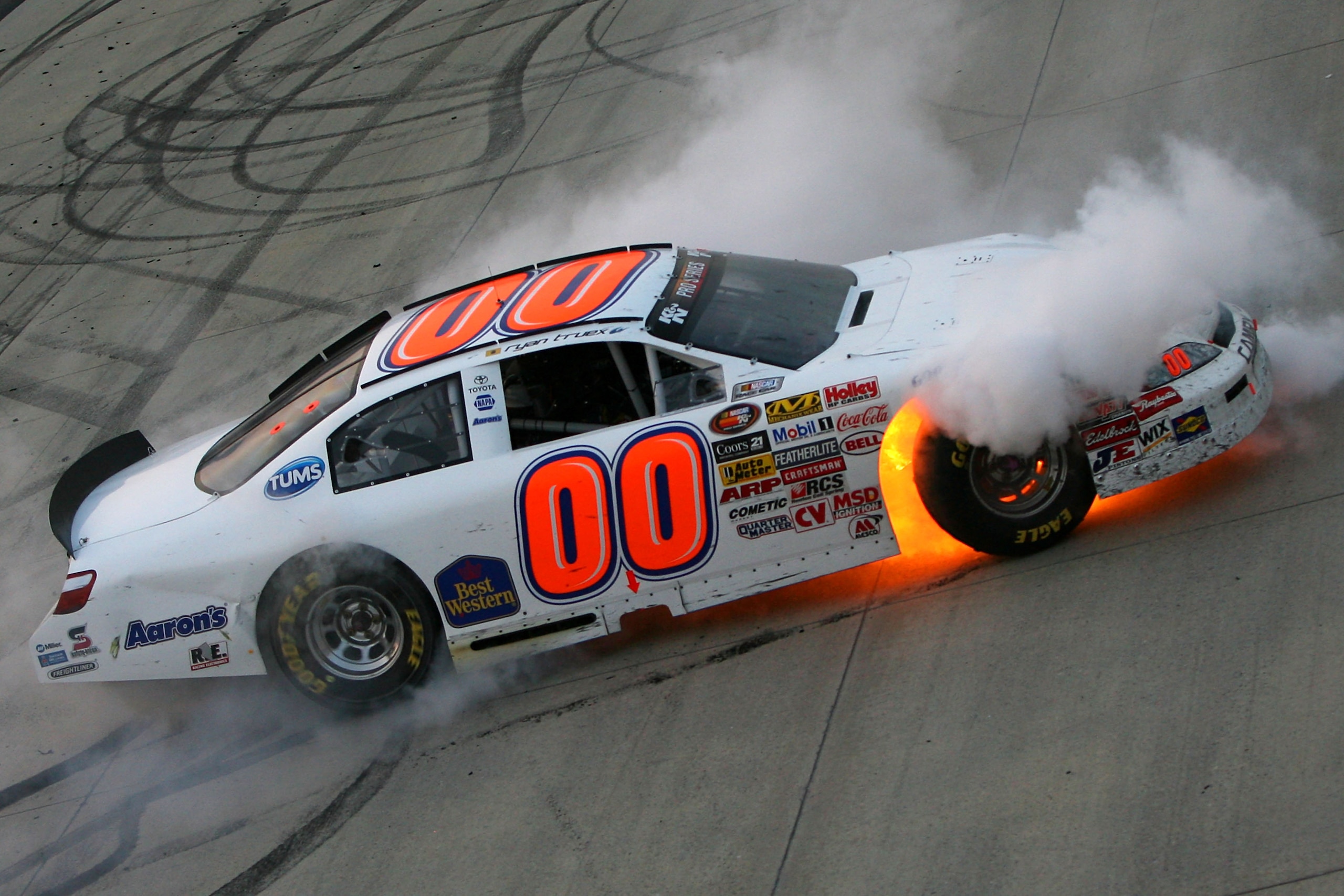 DOVER, DE - SEPTEMBER 24:  Ryan Truex, driver of the #00 Toyota, does a burnout after winning the series championship in the NASCAR K&N Pro Series East Sunoco 150 at Dover International Speedway on September 24, 2010 in Dover, Delaware.  (Photo by Chris T
