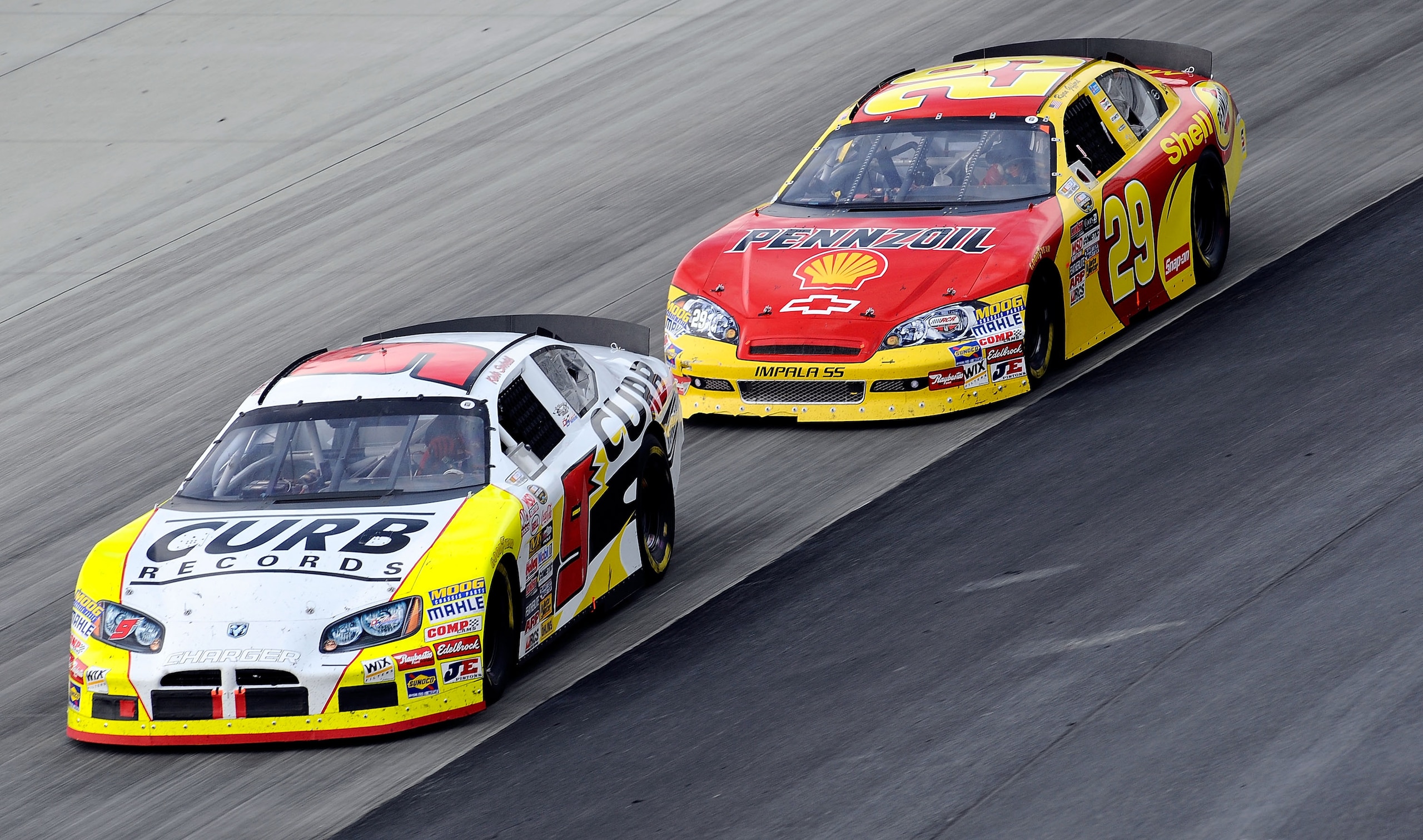 DOVER, DE - SEPTEMBER 25:  Kevin Swindell, driver of the #9 Curb Records Dodge, leads Ryan Gifford, driver of the #29 Shell/Penzoil Chevrolet, during the NASCAR Camping World Series East Sunoco 150 at Dover International Speedway on September 25, 2009 in