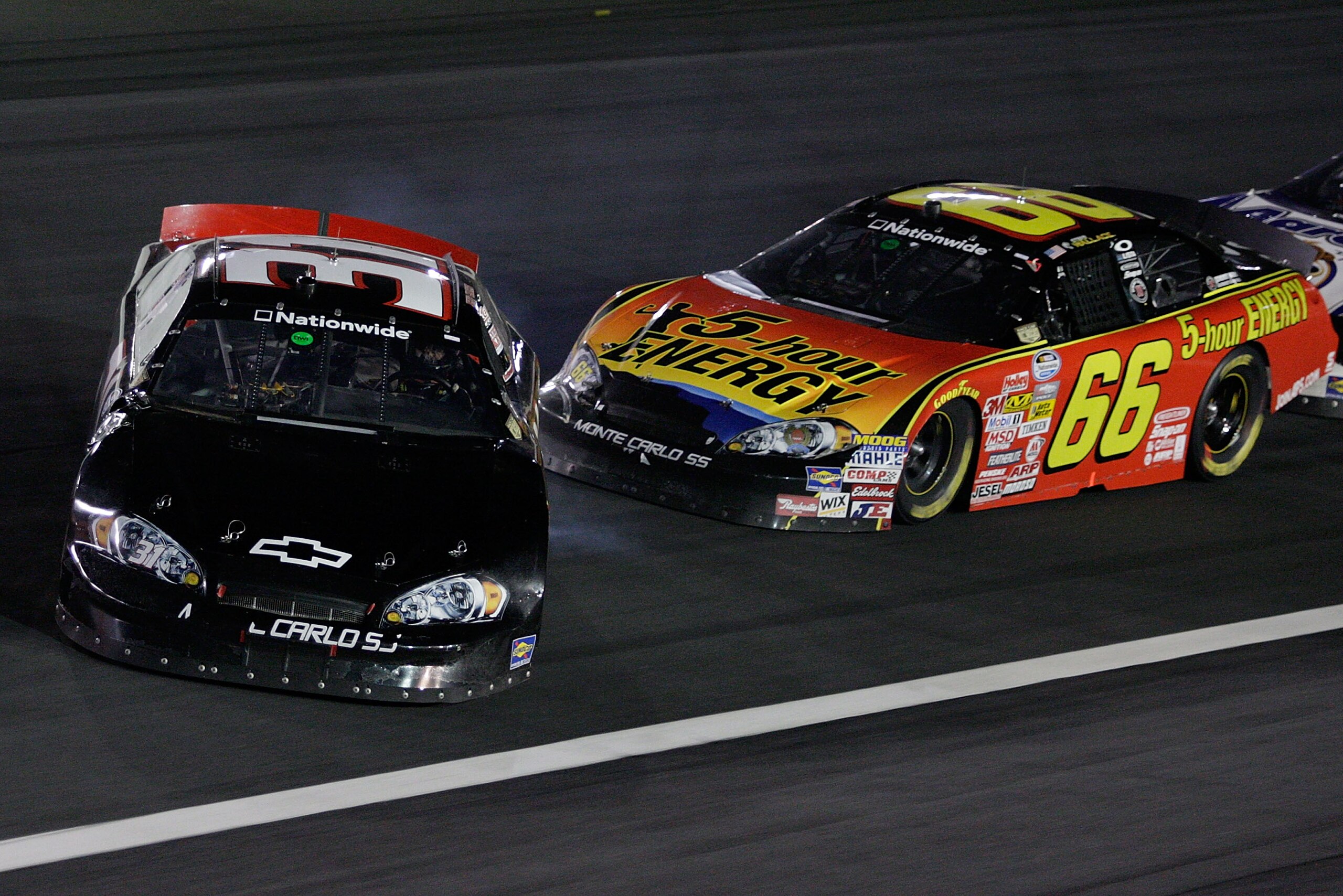 CONCORD, NC - OCTOBER 10:  Jeff Green, driver of the  #31 Key Motorsports Chevrolet, spins out after making contact with Steven Wallace, driver of the #66 5-Hour Energy Chevrolet, during the NASCAR Nationwide Series Dollar General 300 at Lowe's Motor Spee