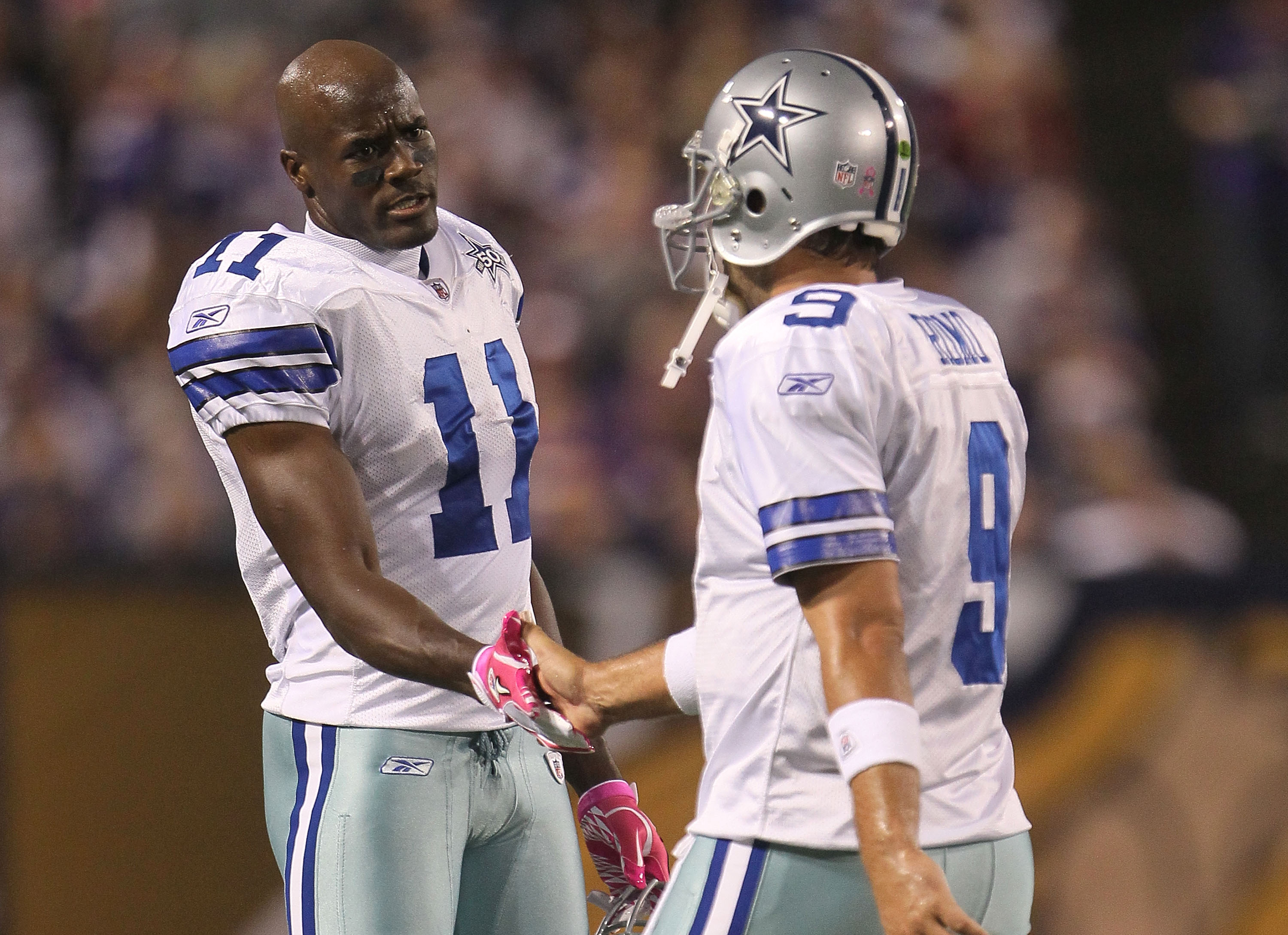 Dallas Cowboys' Roy Williams wears the jersey of teammate Marion