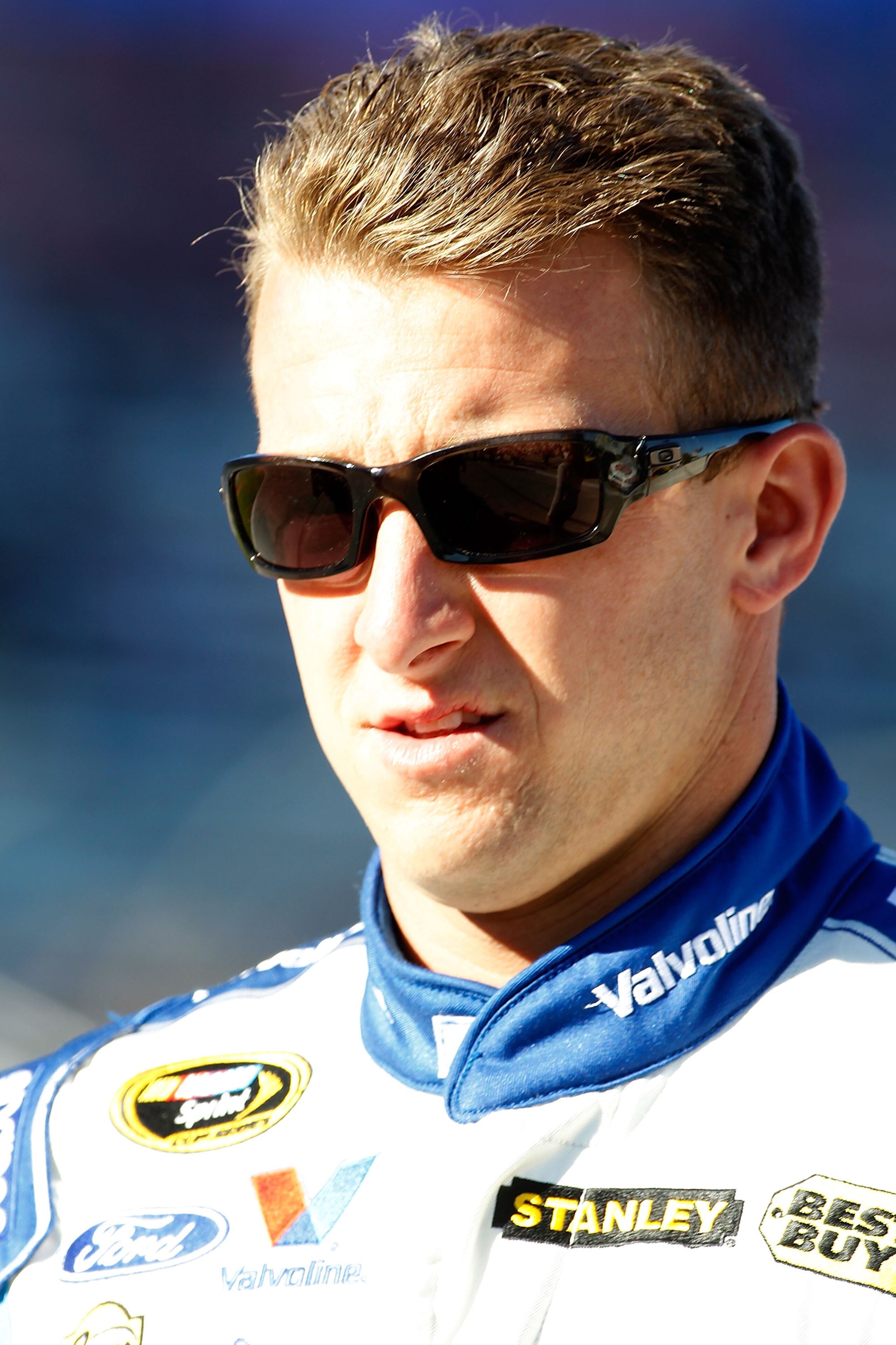 FORT WORTH, TX - NOVEMBER 05:  A.J. Allmendinger, driver of the #43 Valvoline Ford, walks on the grid during qualifying for the NASCAR Sprint Cup Series AAA Texas 500 at Texas Motor Speedway on November 5, 2010 in Fort Worth, Texas.  (Photo by Todd Warsha