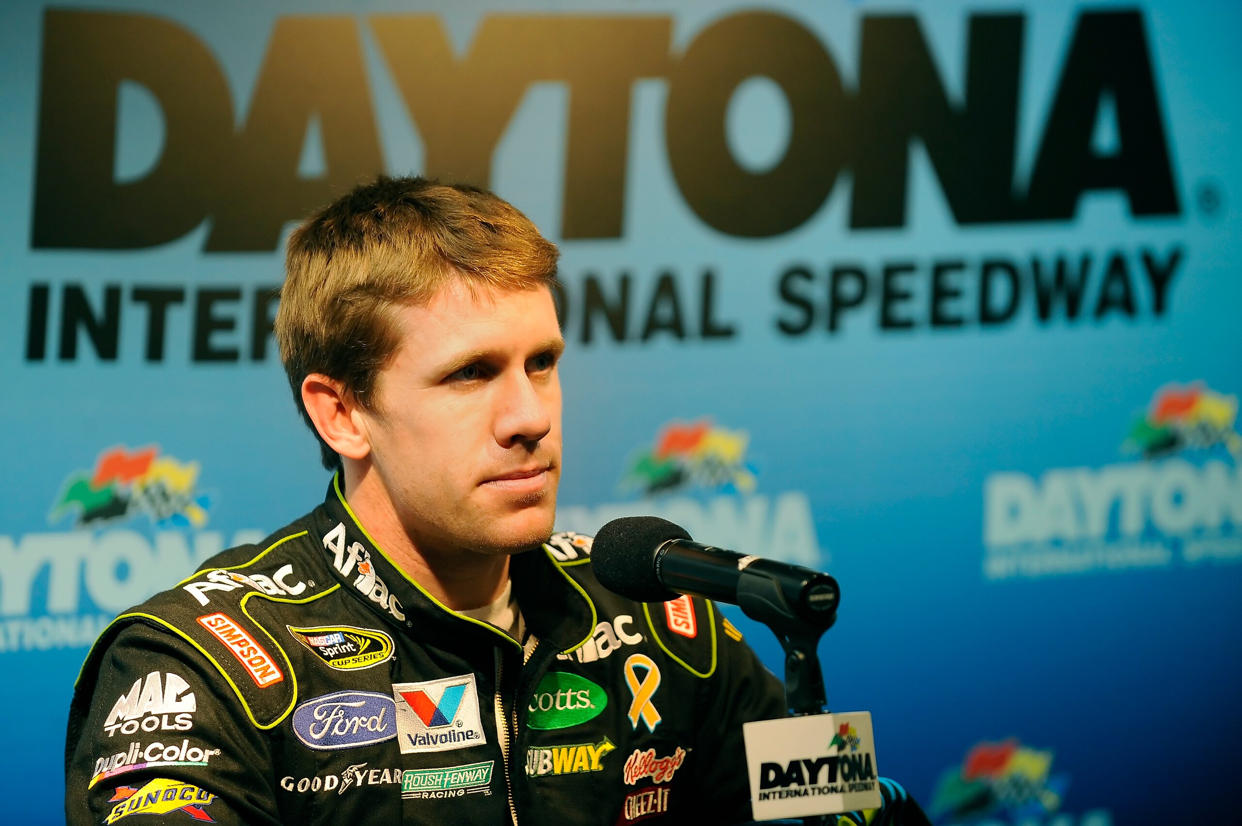 DAYTONA BEACH, FL - JANUARY 20:  Carl Edwards, driver of the #99 Aflac Ford, speaks to the media during the break from testing at Daytona International Speedway on January 20, 2011 in Daytona Beach, Florida.  (Photo by Jared C. Tilton/Getty Images for NAS