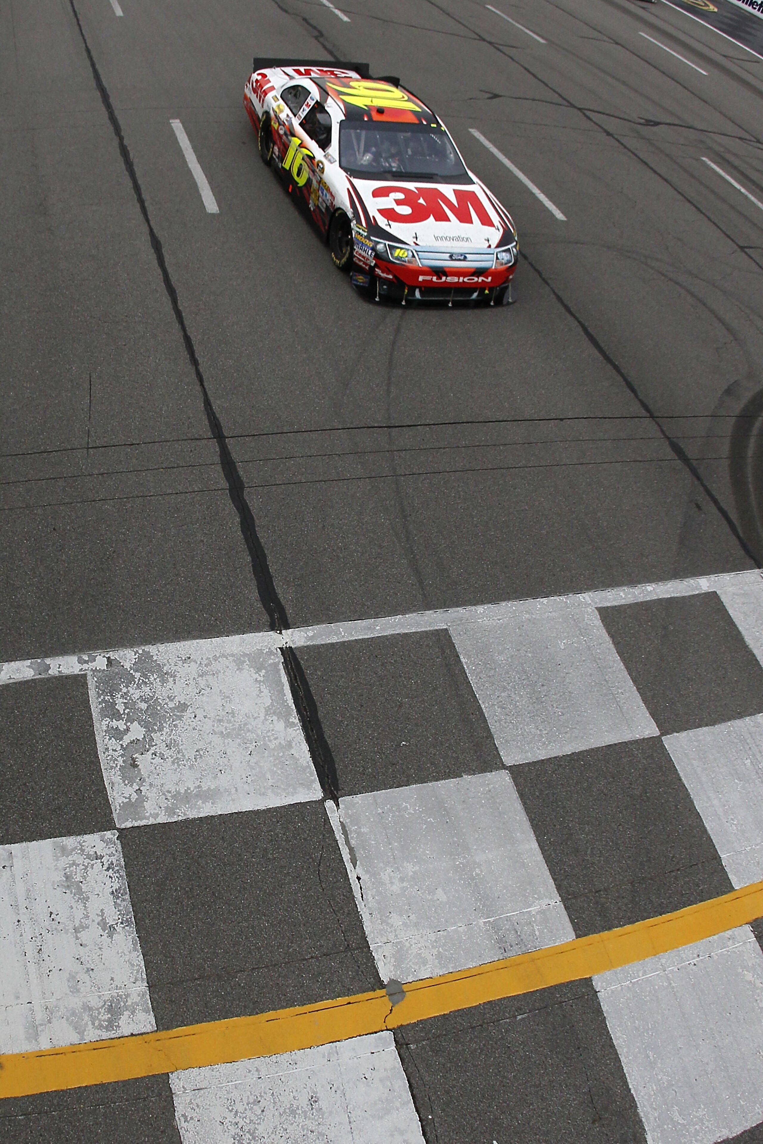 LONG POND, PA - AUGUST 01:  Greg Biffle, driver of the #16 3M Ford, crosses the finish line to win the NASCAR Sprint Cup Series Sunoco Red Cross Pennsylvania 500 at Pocono Raceway on August 1, 2010 in Long Pond, Pennsylvania.  (Photo by Todd Warshaw/Getty