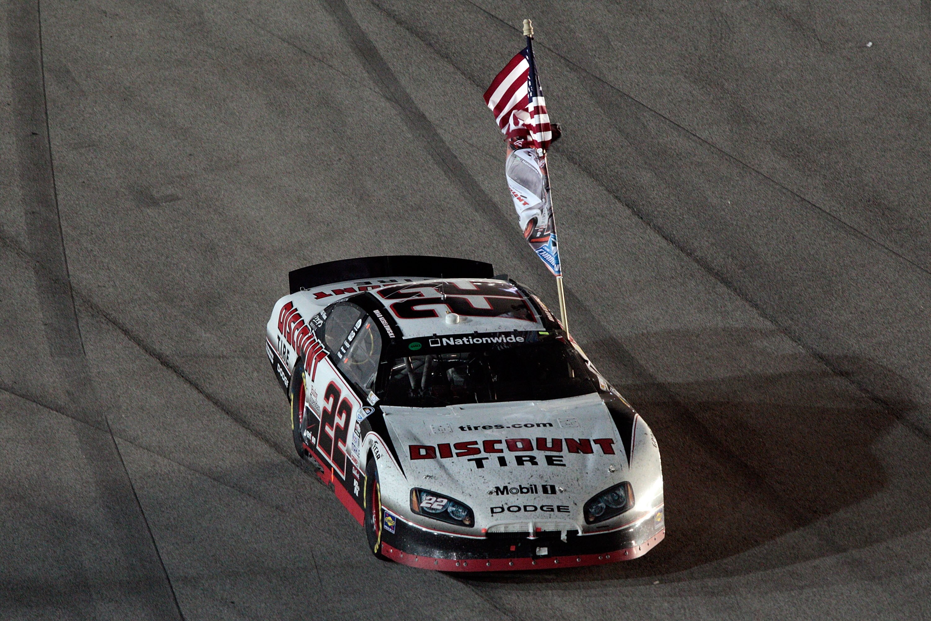 HOMESTEAD, FL - NOVEMBER 20:  Brad Keselowski, driver of the #22 Discount Tire Dodge, celebrates winning the NASCAR Nationwide Series championship following the Ford 300 at Homestead-Miami Speedway on November 20, 2010 in Homestead, Florida.  (Photo by Ch