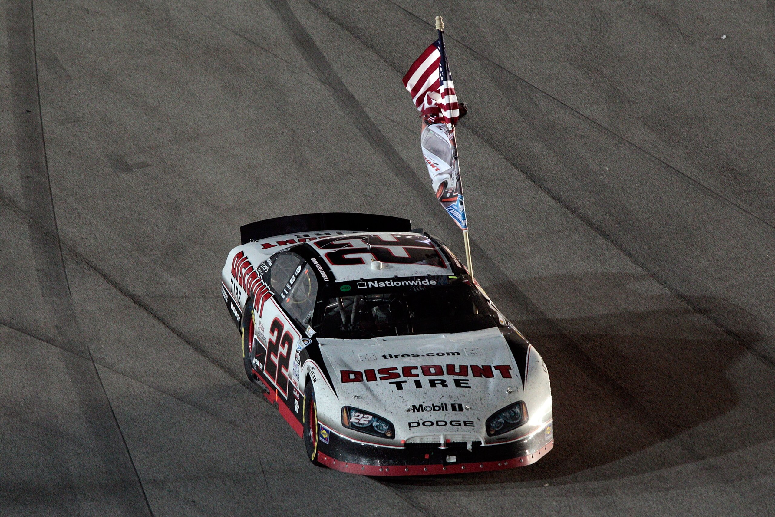 HOMESTEAD, FL - NOVEMBER 20:  Brad Keselowski, driver of the #22 Discount Tire Dodge, celebrates winning the NASCAR Nationwide Series championship following the Ford 300 at Homestead-Miami Speedway on November 20, 2010 in Homestead, Florida.  (Photo by Ch