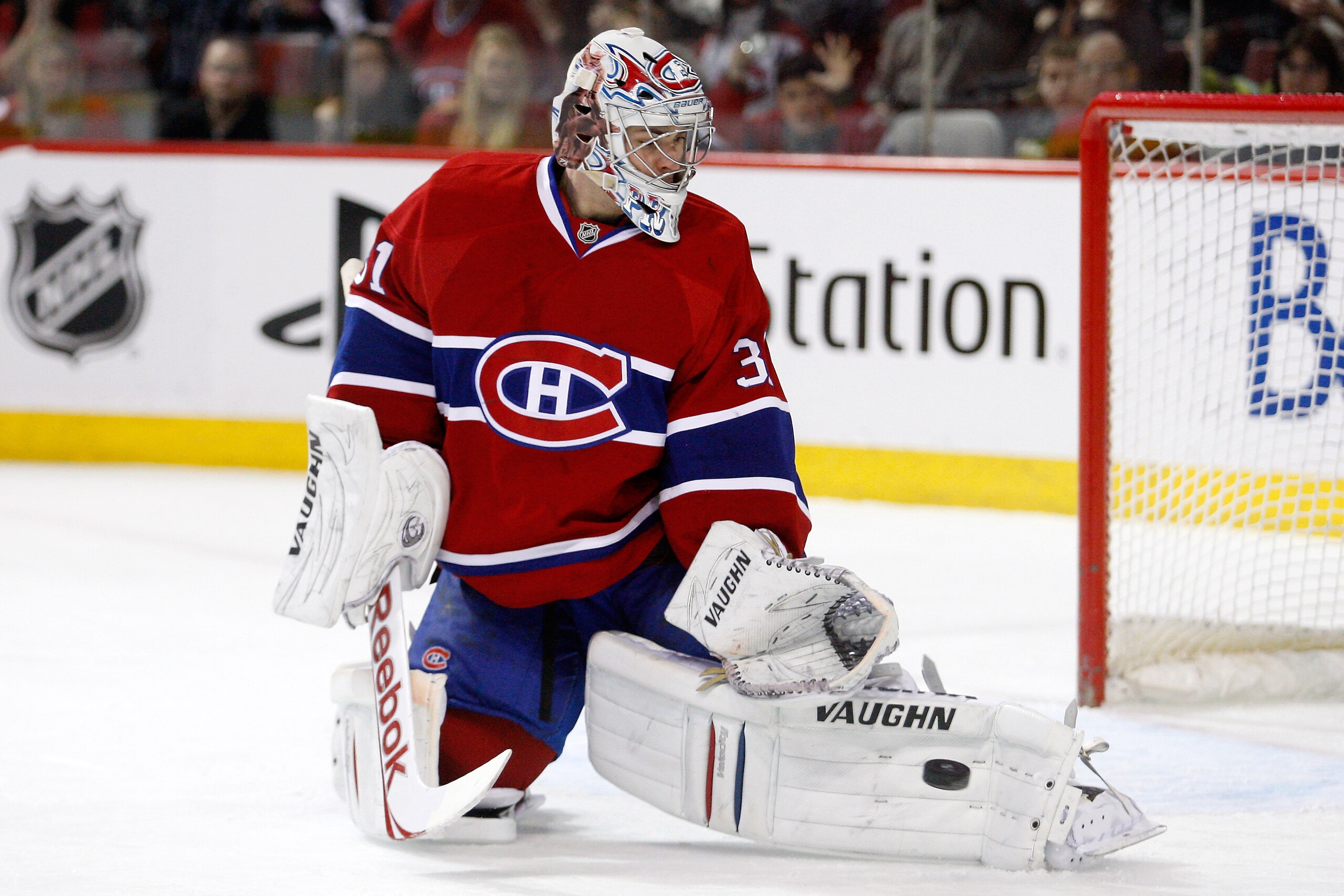 MONTREAL, CANADA - JANUARY 22:  Carey Price #31 of the Montreal Canadiens makes a pad save on the puck in overtime on a shot by Bobby Ryan #9 of the Anaheim Ducks (not pictured) during the NHL game at the Bell Centre on January 22, 2011 in Montreal, Quebe