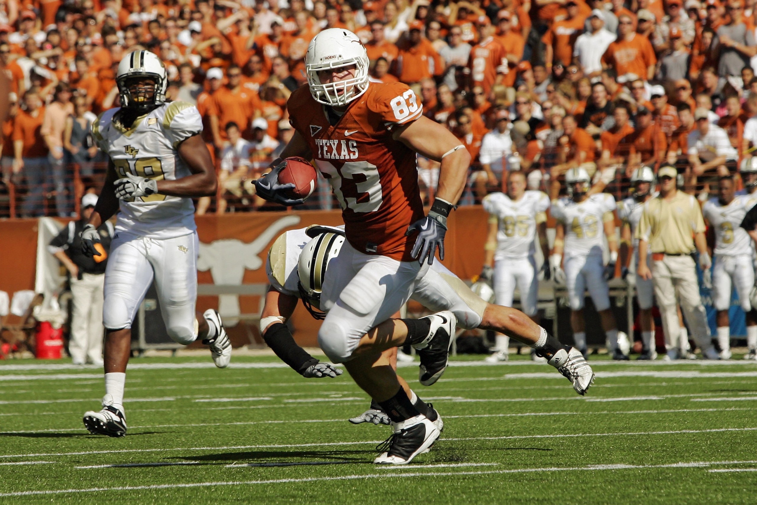 AUSTIN, TX - NOVEMBER 07: Tight end Greg Smith #83 of the Texas Longhorns runs with a catch against the UCF Knights on November 7, 2009 at Darrell K Royal - Texas Memorial Stadium in Austin, Texas. Texas won 35-3. (Photo by Brian Bahr/Getty Images) AUSTIN, TX - NOVEMBER 07: Tight end Greg Smith #83 of the Texas Longhorns runs with a catch against the UCF Knights on November 7, 2009 at Darrell K Royal - Texas Memorial Stadium in Austin, Texas. Texas won 35-3. (Photo by Brian Bahr/Getty Images)
