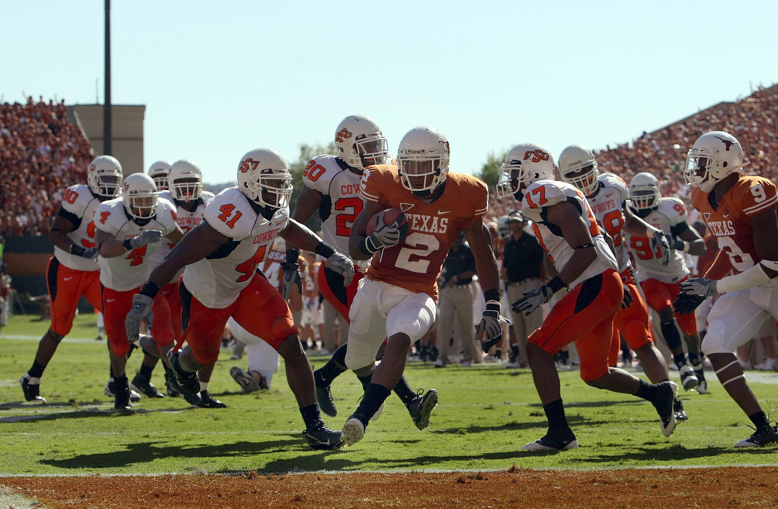 AUSTIN, TX - OCTOBER 25: Running back Vondrell McGee #2 of the Texas Longhorns runs for a touchdown against Orie Lemon #41 of the Oklahoma State Cowboys at Texas Memorial Stadium on October 25, 2008 in Austin, Texas. (Photo by Ronald Martinez/Getty Imag AUSTIN, TX - OCTOBER 25: Running back Vondrell McGee #2 of the Texas Longhorns runs for a touchdown against Orie Lemon #41 of the Oklahoma State Cowboys at Texas Memorial Stadium on October 25, 2008 in Austin, Texas. (Photo by Ronald Martinez/Getty Imag