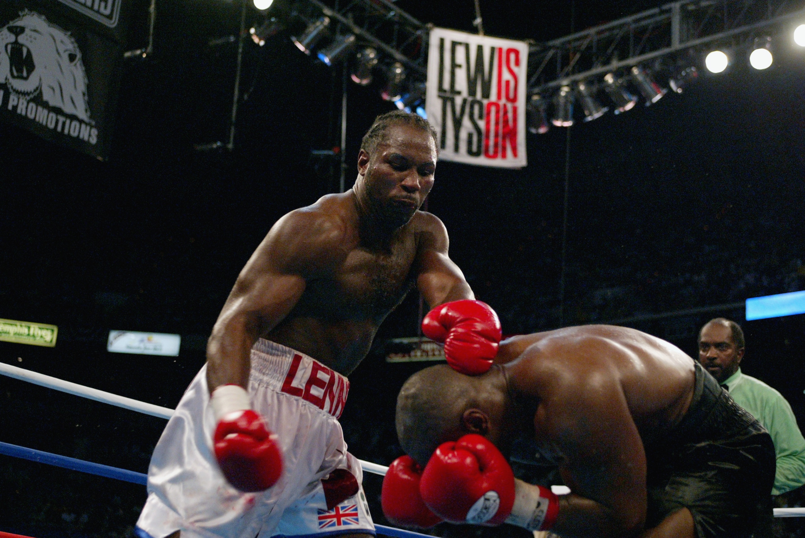MEMPHIS, TN - JUNE 8: Lennox Lewis dominates the fight against Mike Tyson during their WBC/IBF heavyweight championship bout on June 8, 2002 at The Pyramid in Memphis, Tennessee.  Lewis won the bout by way of knockout in the 8th round.  (Photo by Al Bello