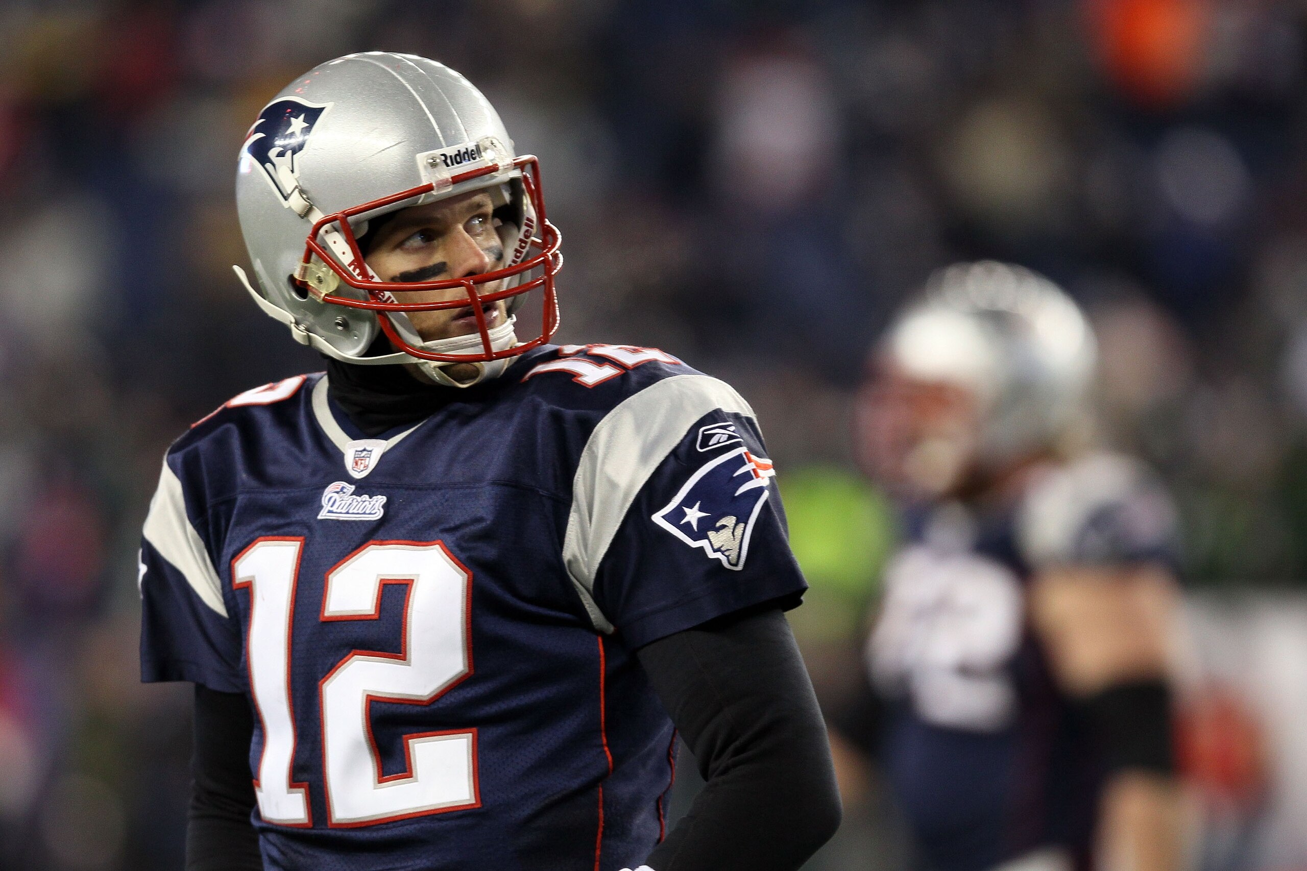 FOXBORO, MA - JANUARY 16:  Tom Brady #12 of the New England Patriots looks on near the end of their 28 to 21 loss to the New York Jets in their 2011 AFC divisional playoff game at Gillette Stadium on January 16, 2011 in Foxboro, Massachusetts.  (Photo by