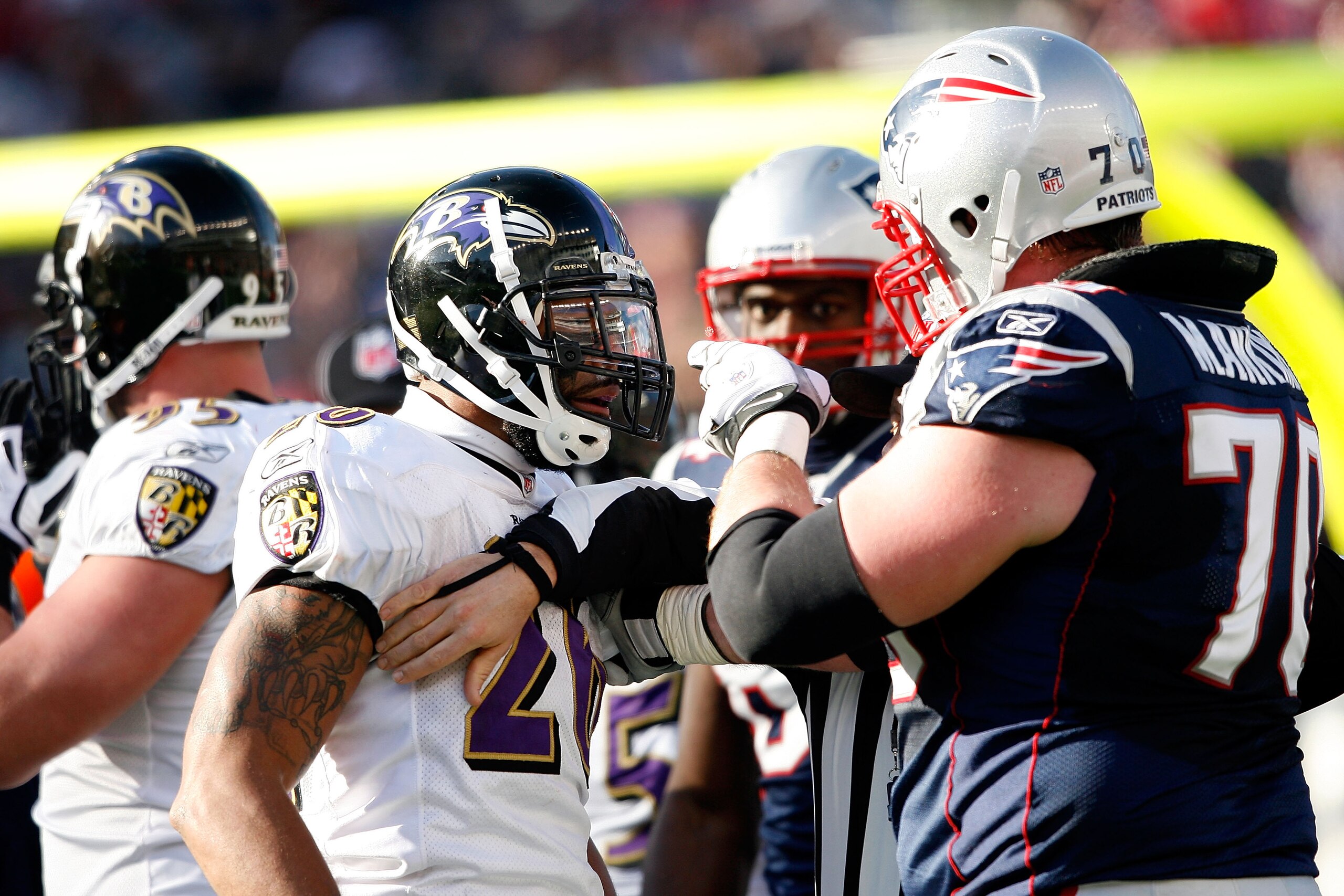 FOXBORO, MA - JANUARY 10:  Logan Mankins #70 of the New England Patriots and Ed Reed #20 of  the Baltimore Ravens get in each others face during the 2010 AFC wild-card playoff game at Gillette Stadium on January 10, 2010 in Foxboro, Massachusetts.  (Photo