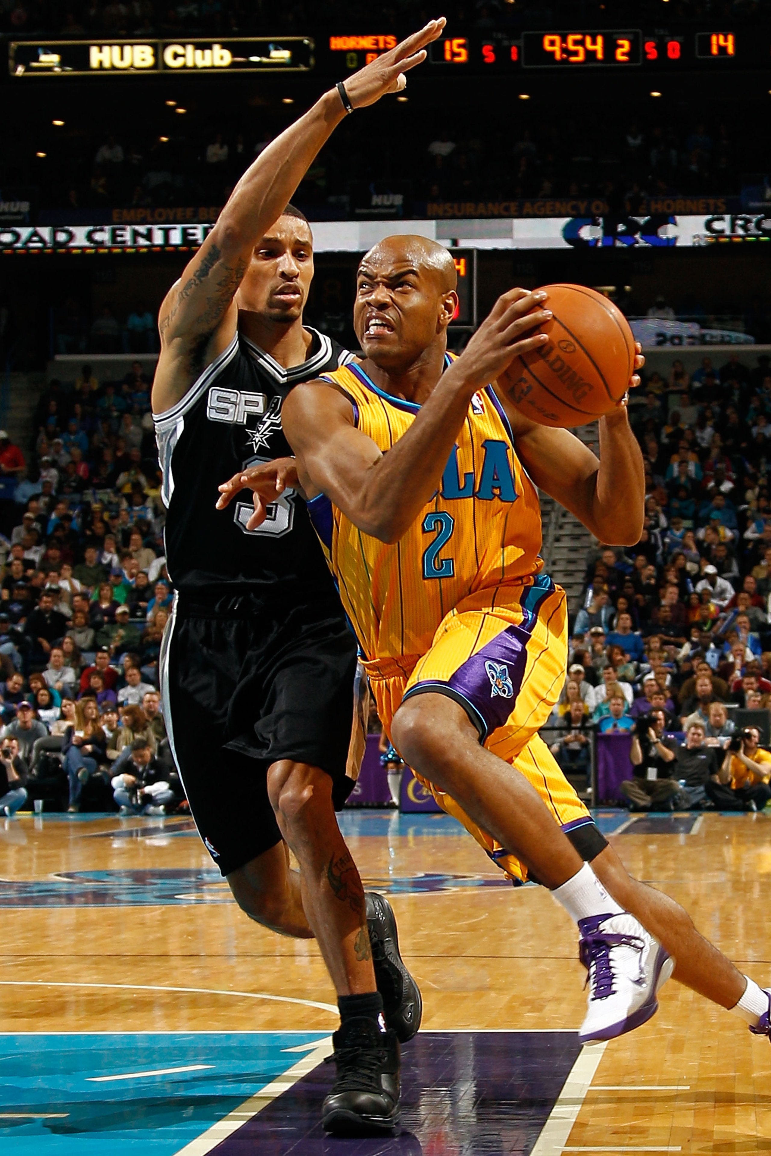 NEW ORLEANS, LA - JANUARY 22:  Jarrett Jack #2 of the New Orleans Hornets drives the ball around George Hill #3 of the San Antonio Spurs at the New Orleans Arena on January 22, 2011 in New Orleans, Louisiana.  The Hornets defeated the Spurs 96-72.  NOTE T