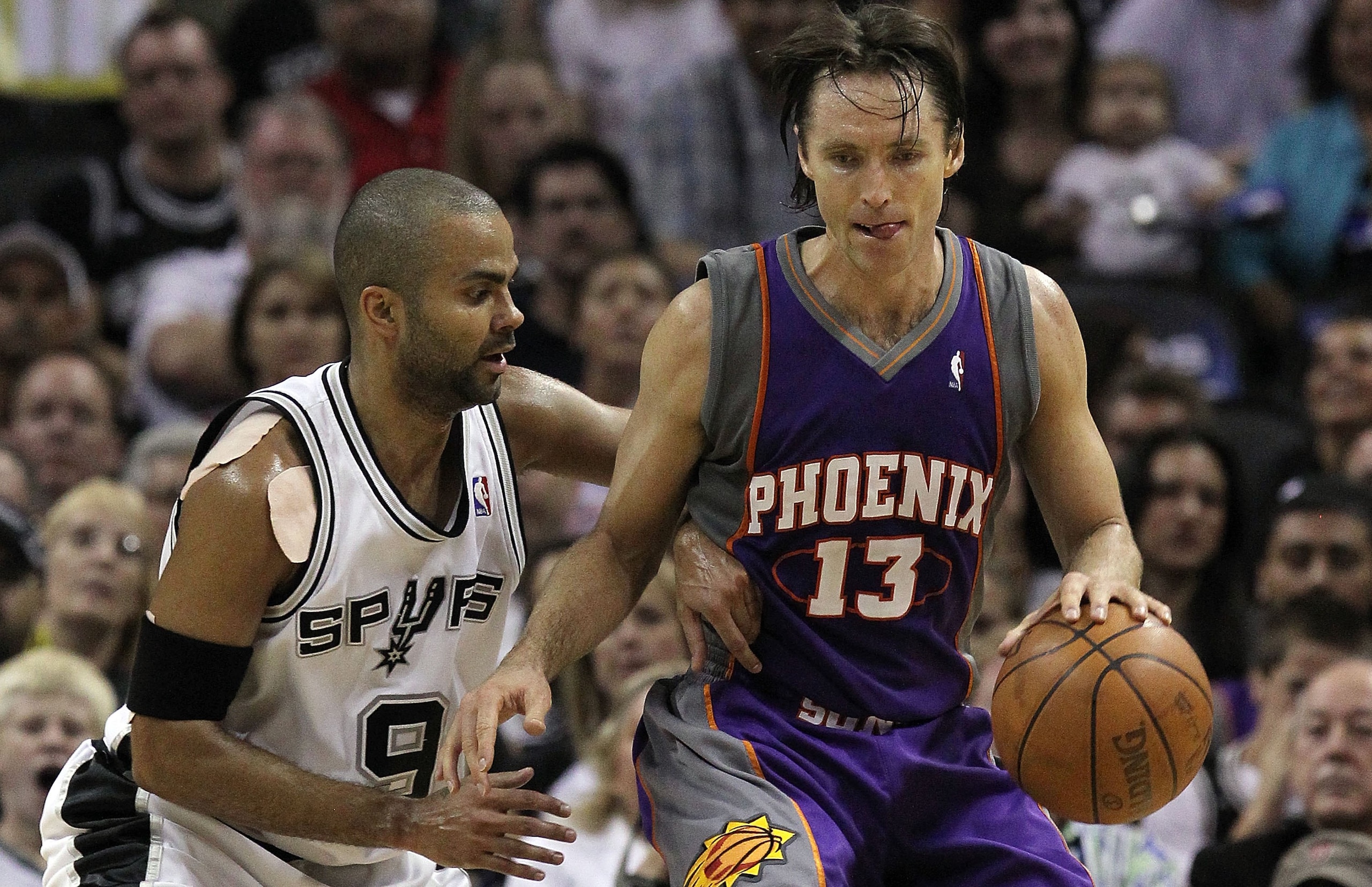 SAN ANTONIO - MAY 09:  Guard Steve Nash #13 of the Phoenix Suns dribbles the ball past Tony Parker #9 of the San Antonio Spurs in Game Four of the Western Conference Semifinals during the 2010 NBA Playoffs at AT&T Center on May 9, 2010 in San Antonio, Tex
