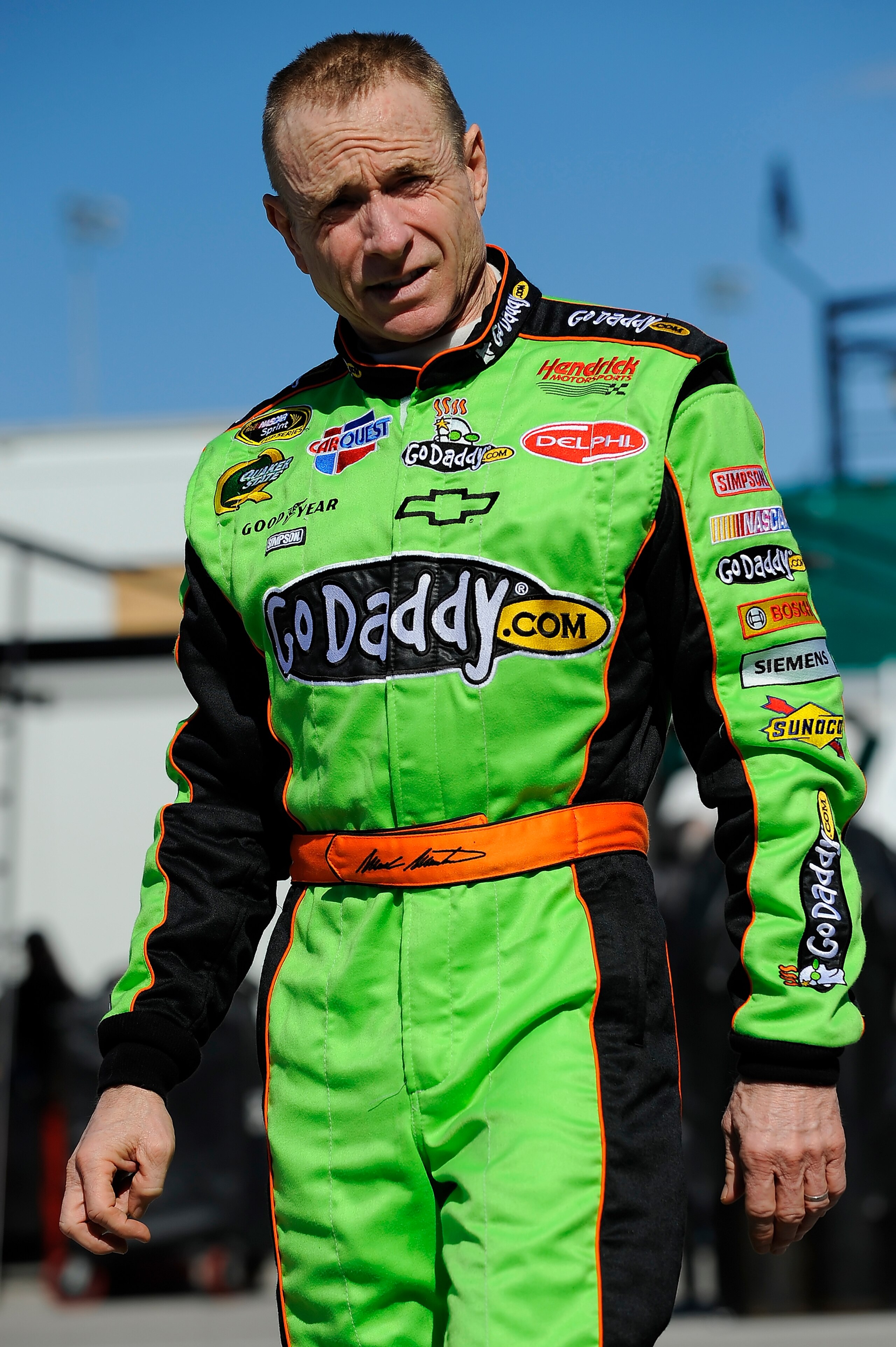 DAYTONA BEACH, FL - JANUARY 22:  Mark Martin, driver of the #5 GoDaddy.com Chevrolet, walks through the garage during testing at Daytona International Speedway on January 22, 2011 in Daytona Beach, Florida.  (Photo by Jared C. Tilton/Getty Images for NASC