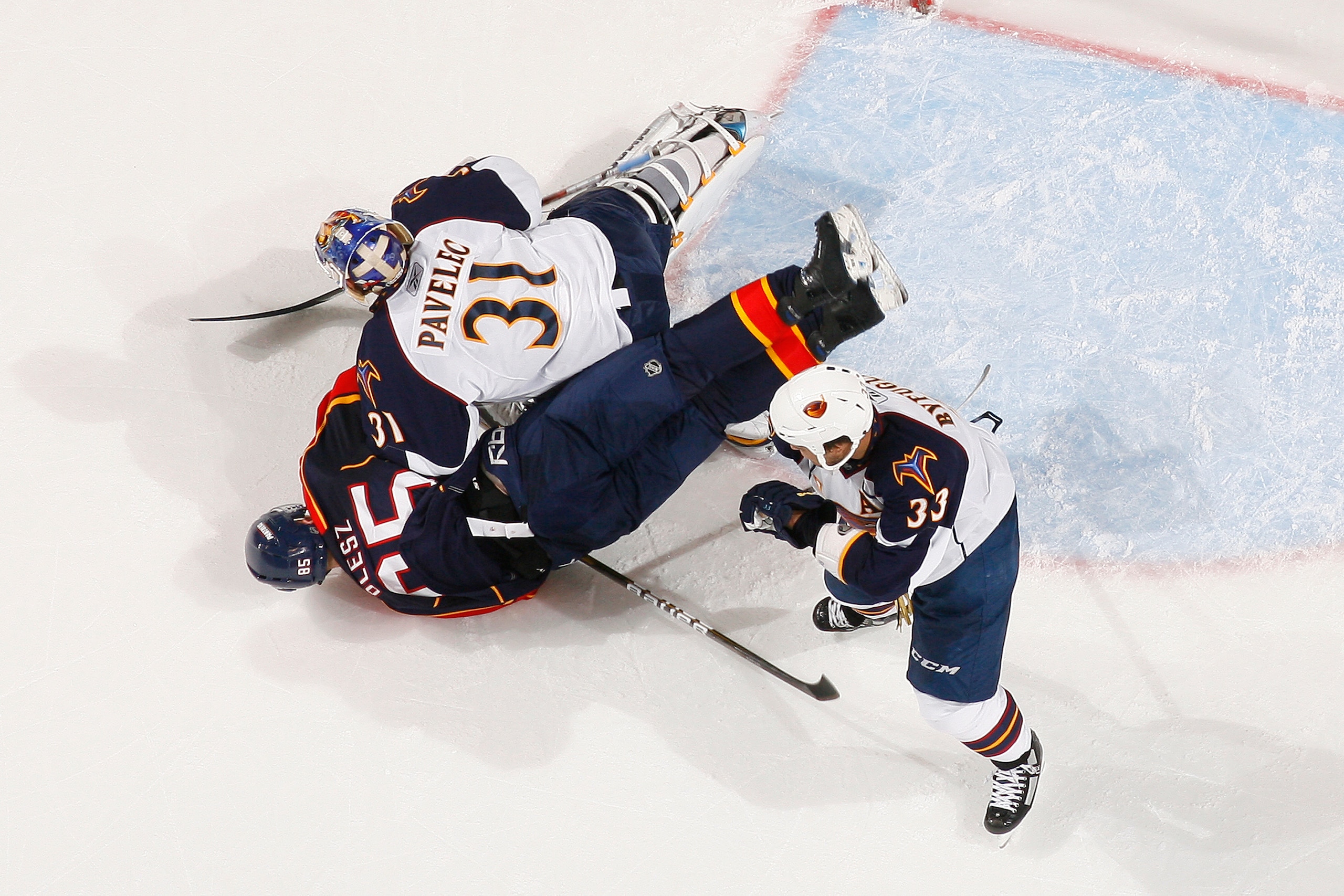 SUNRISE, FL - JANUARY 17: Dustin Byfuglien #33 of the Atlanta Thrashers watches as Rostislav Olesz #85 of the Florida Panthers collides with goaltender Ondrej Pavelec #31 on January 17, 2011 at the BankAtlantic Center in Sunrise, Florida. The Thrashers de
