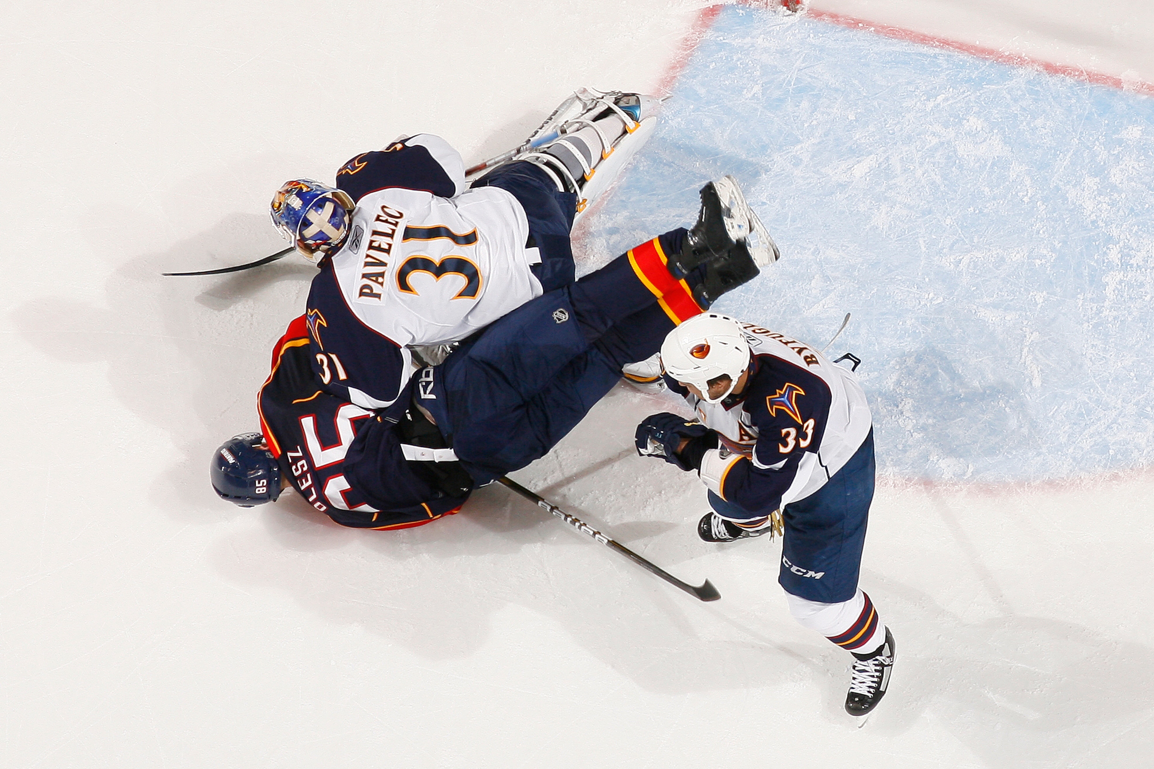 SUNRISE, FL - JANUARY 17: Dustin Byfuglien #33 of the Atlanta Thrashers watches as Rostislav Olesz #85 of the Florida Panthers collides with goaltender Ondrej Pavelec #31 on January 17, 2011 at the BankAtlantic Center in Sunrise, Florida. The Thrashers de
